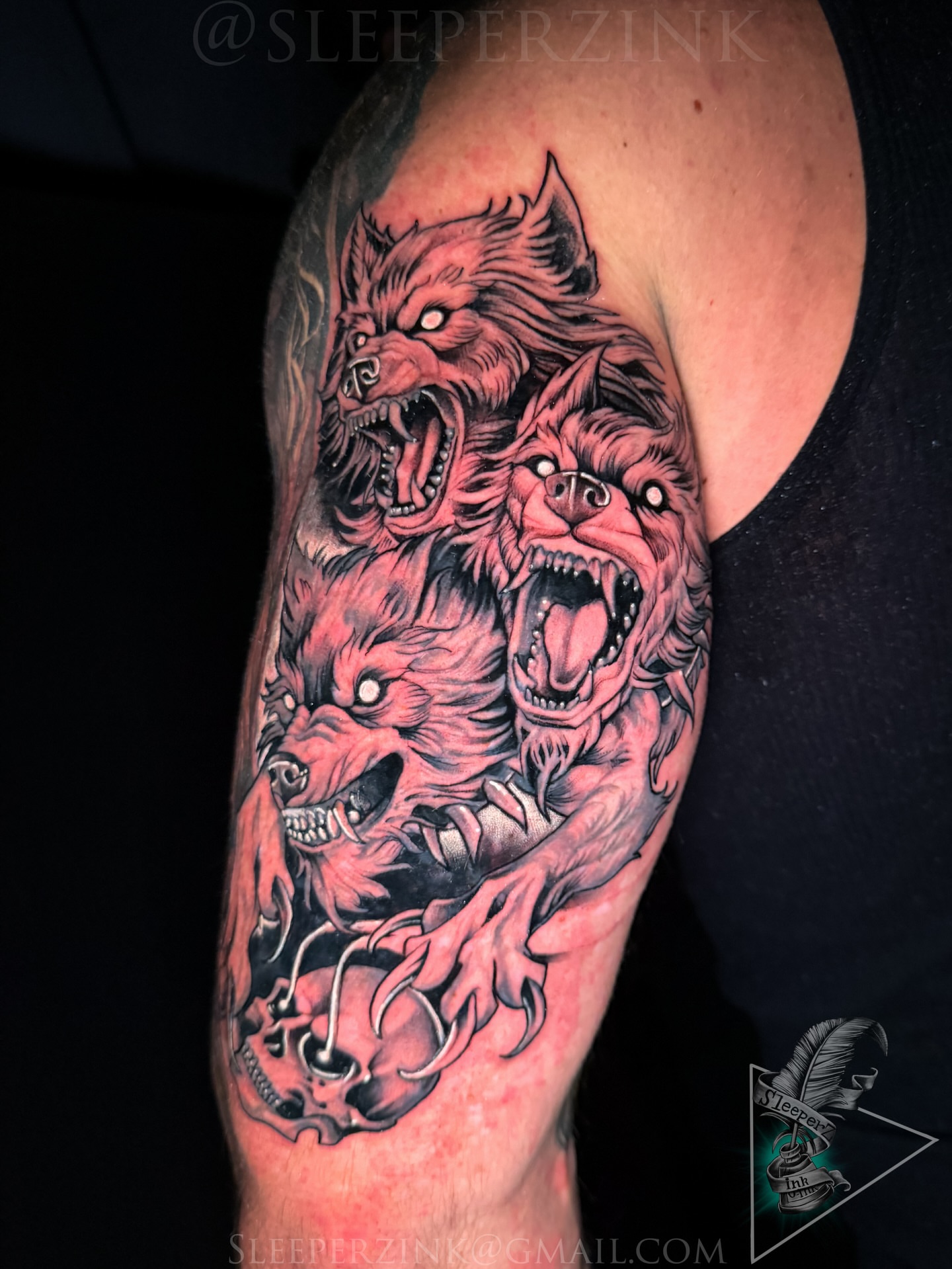 Three wolves dark realism tattoo on the forearm by Travis Sleeper