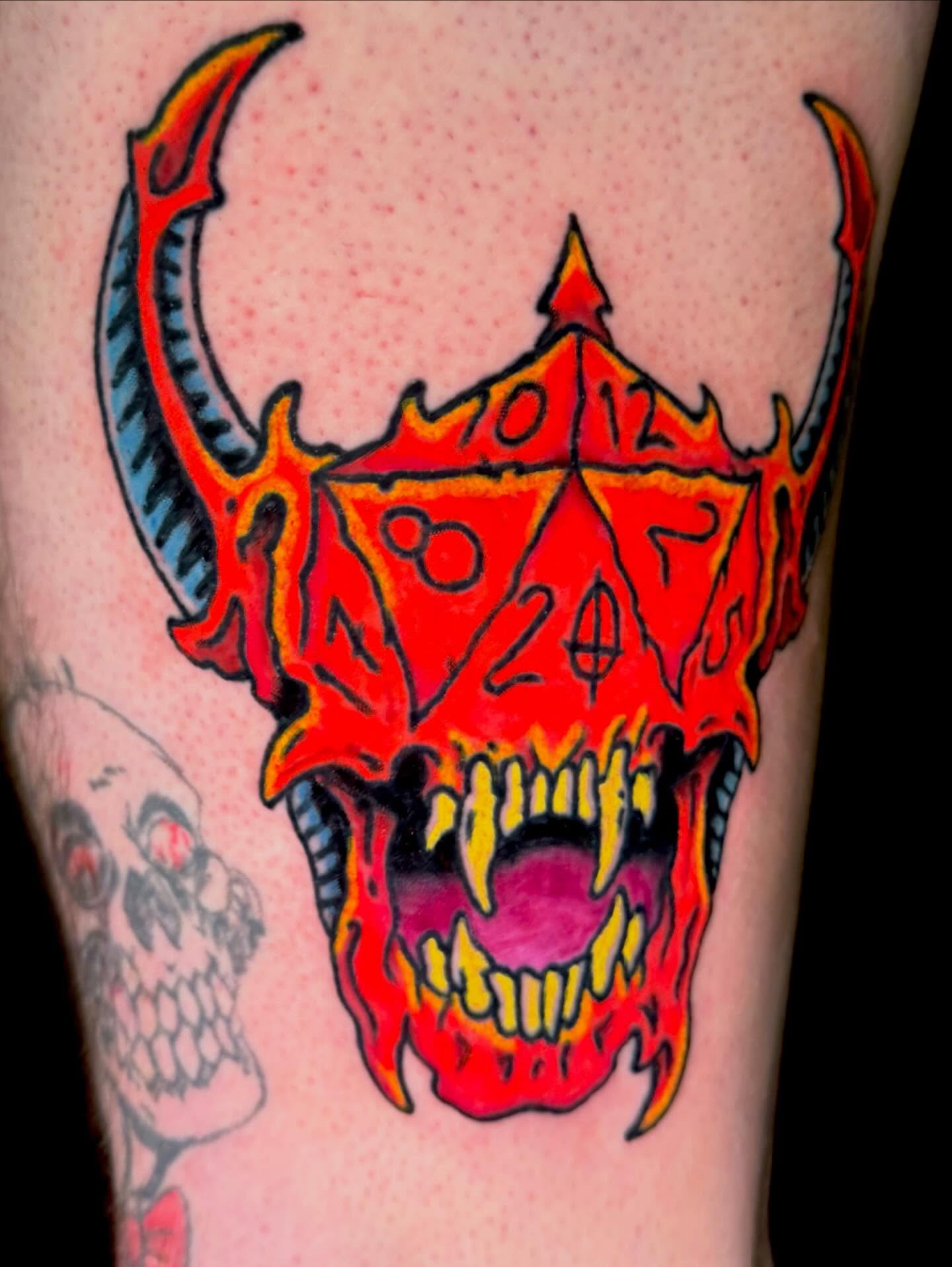 Demon skull American traditional tattoo on the forearm by Henry Bubula, Minneapolis, Minnesota