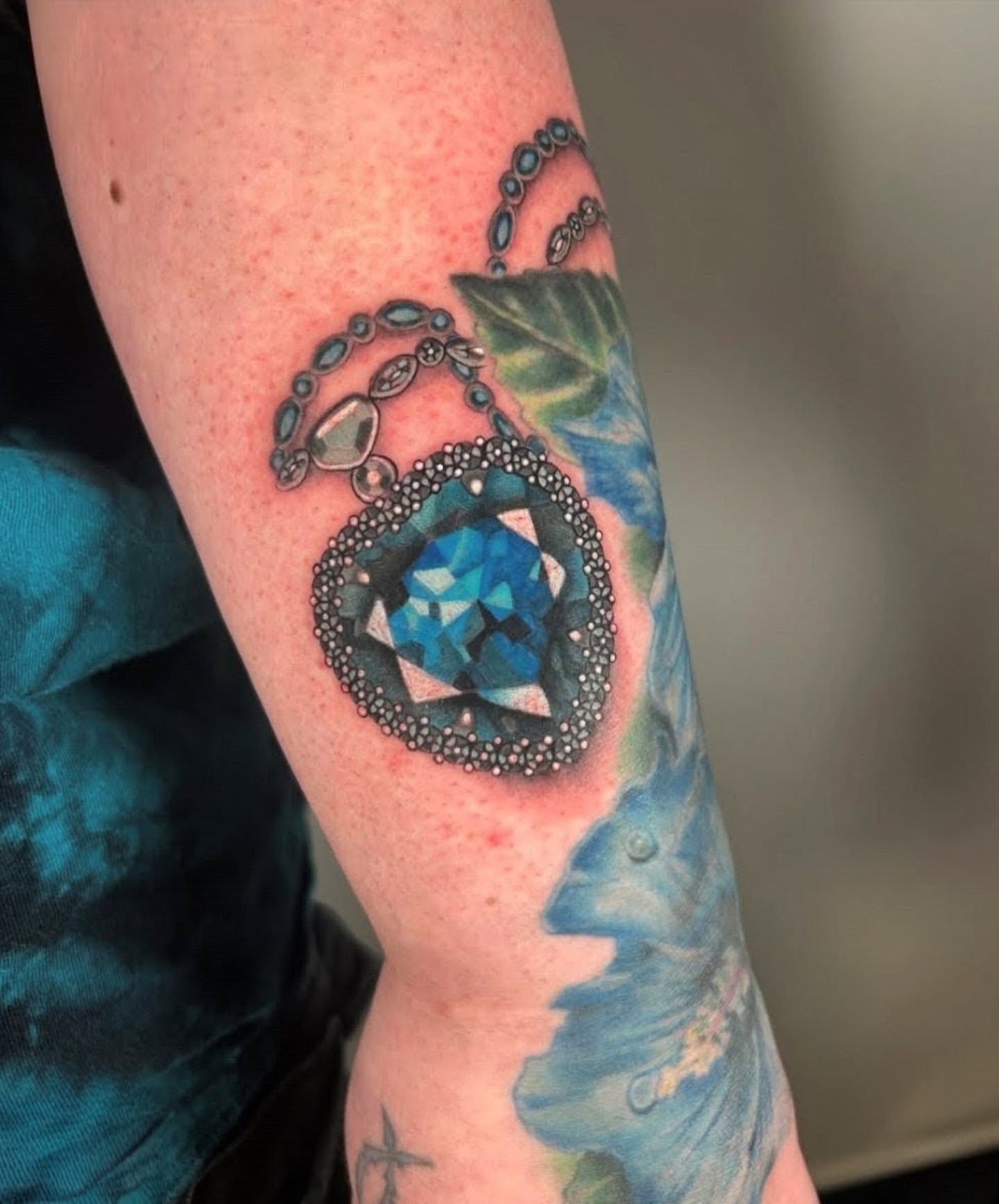 Gemstone dotwork tattoo on the forearm by Chloe Marie
