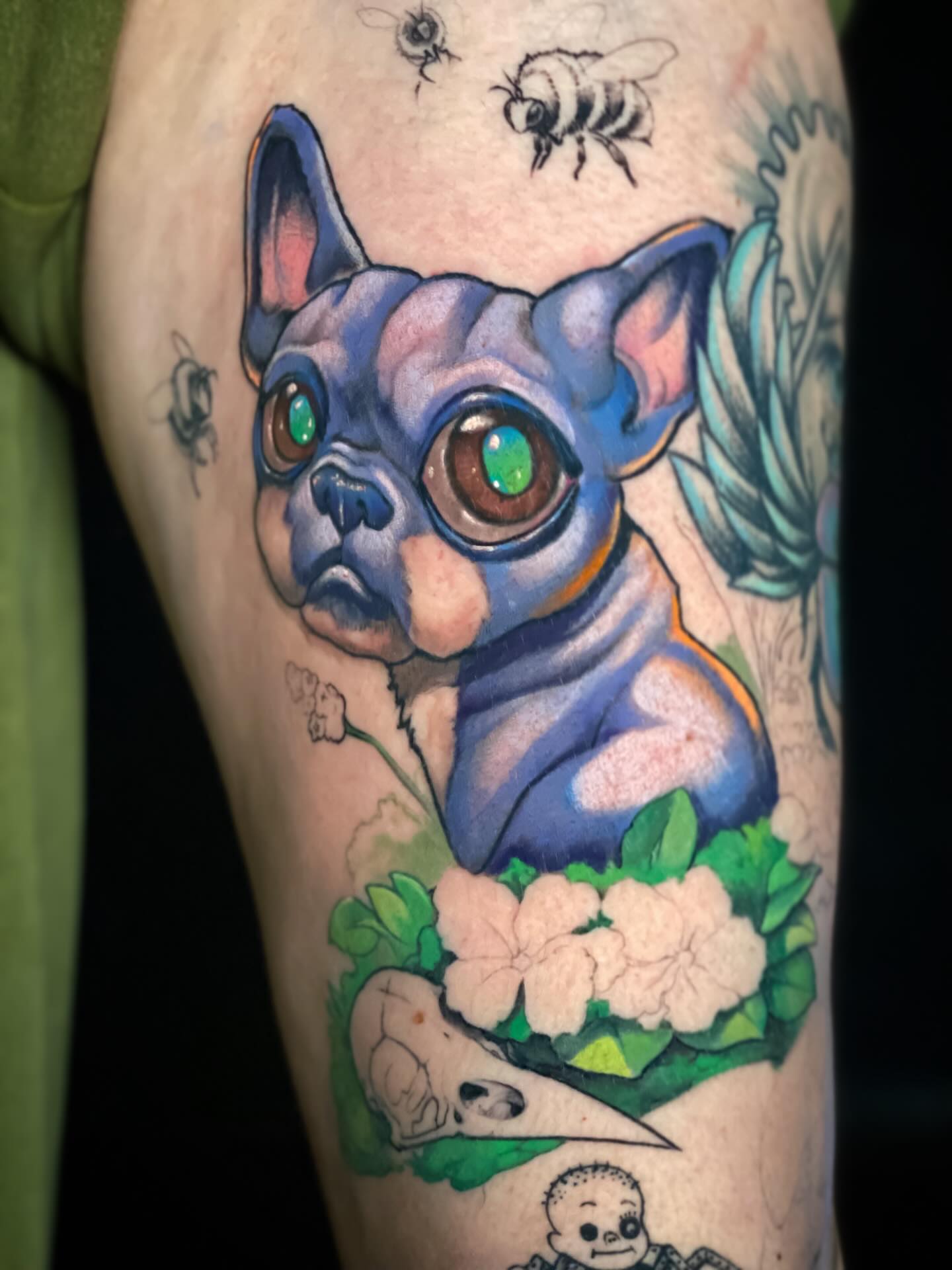 Blue dog with flowers realism tattoo on the forearm by Picasso Dular, Lake Forest, California