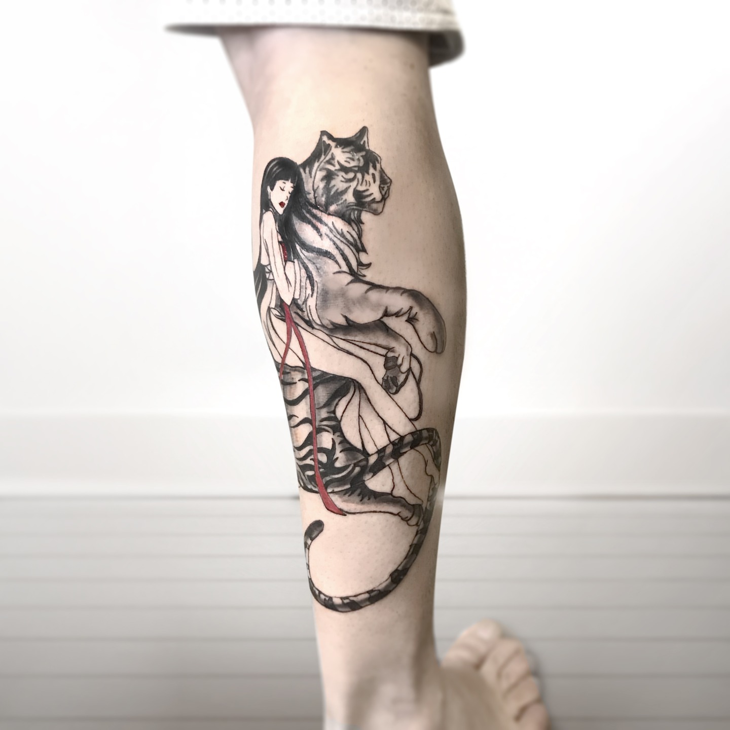 Woman riding tiger realism tattoo on the calf by R o s e