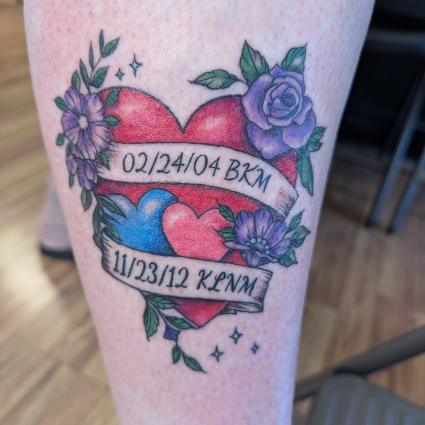 Heart with dates American traditional tattoo on the leg by Chad Nuber