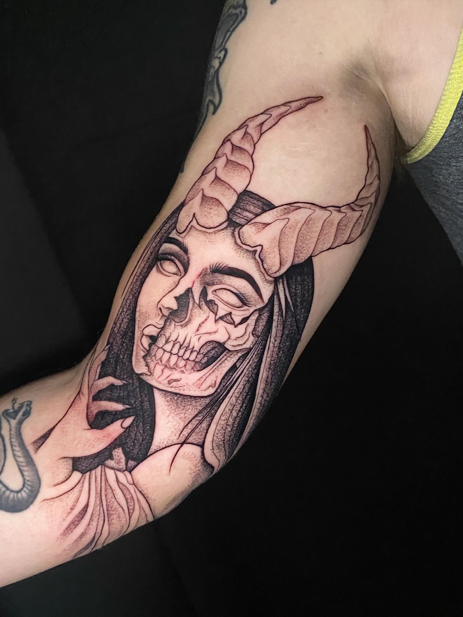 Demon skull realism tattoo on the forearm by Casey Dohner