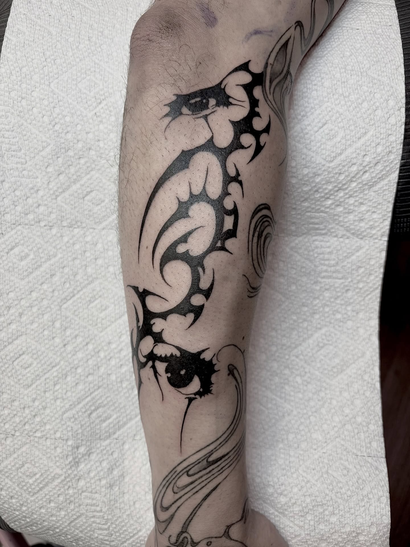 Eyes and floral swirls tribal tattoo on the forearm by <3 eve’s tattoos <3