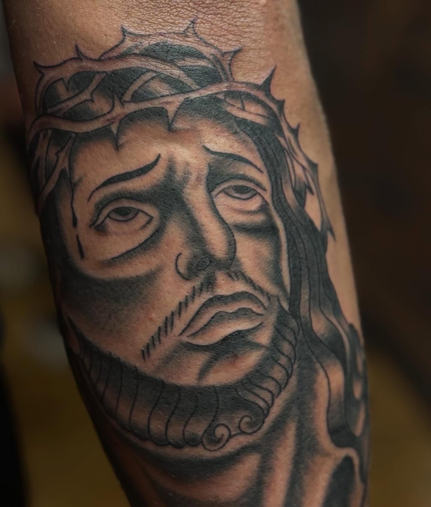 Jesus Christ realism tattoo on the forearm by @spicy.curry.tattoos