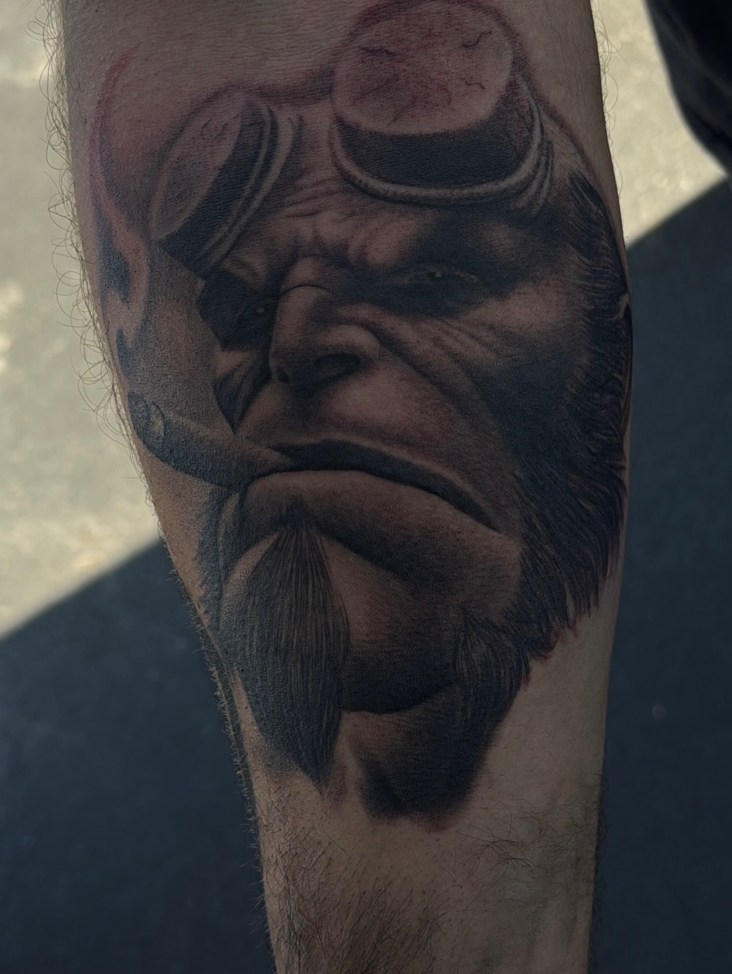 Man with goggles realism tattoo on the forearm by Nick Campbell