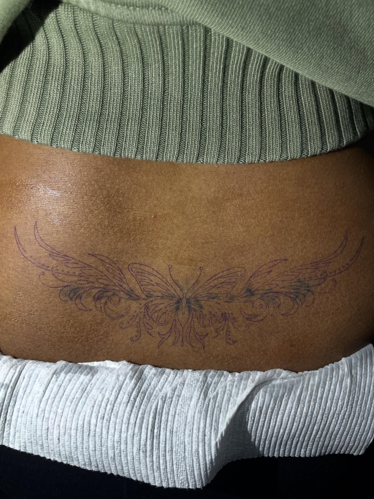 Butterfly fine line tattoo on the torso by TreCashTats💉🩸 MisfitzTattooStudio