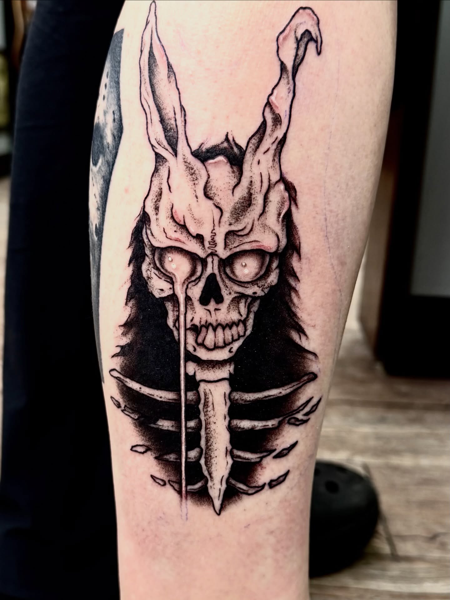 Skull with horns dark realism tattoo on the forearm by Josh Kronauer
