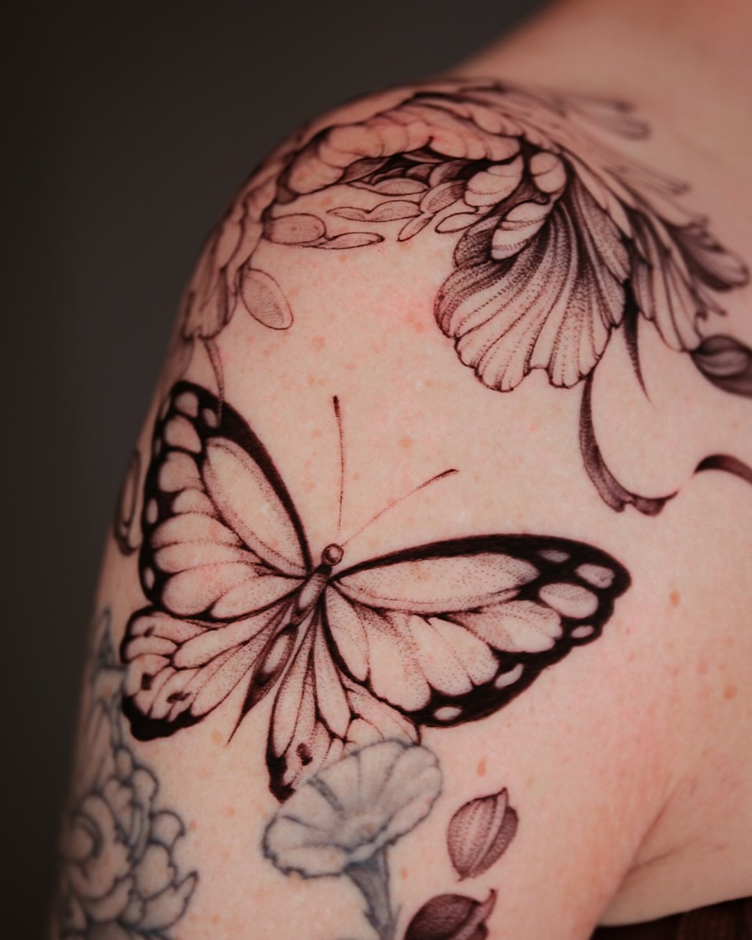 Butterfly black and grey tattoo on the shoulder by Esther ✣ Fine Line Floral Tattoo Artist LA, Los Angeles, California
