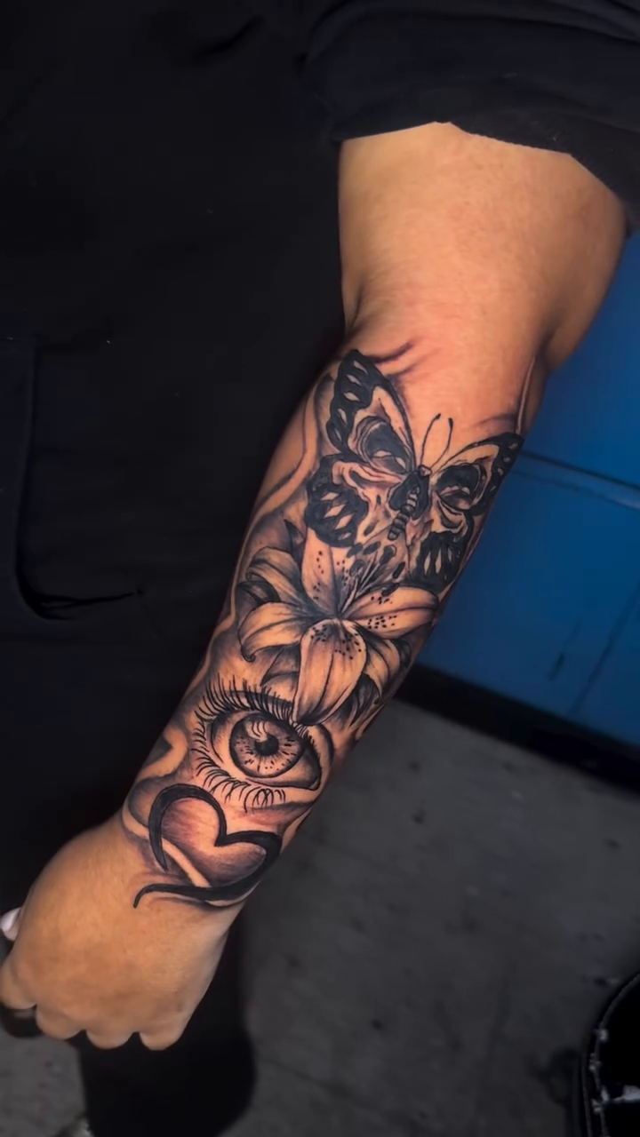 Butterfly and flowers realism tattoo by Dope