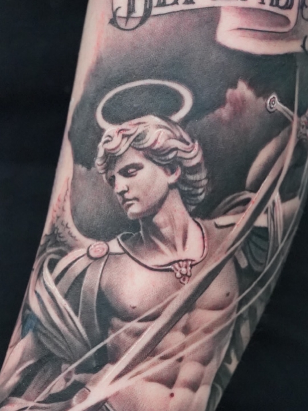 Angelic figure realism tattoo on the forearm by Luis Rodriguez