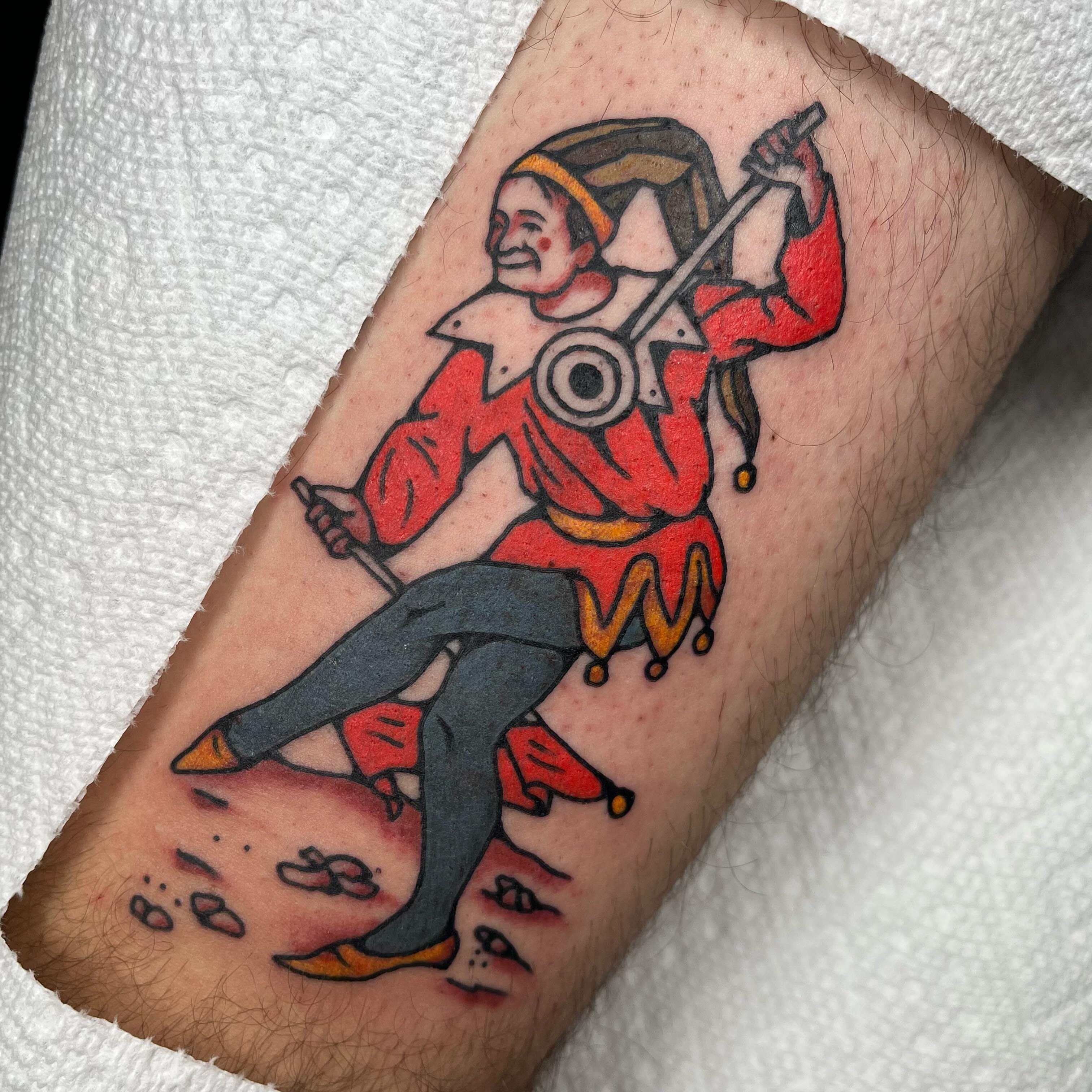 Jester American traditional tattoo on the forearm by Jennifer Medrano