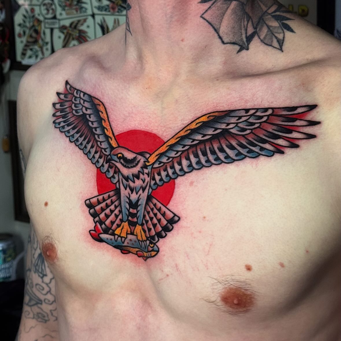 Hawk American traditional tattoo on the chest by Larry Love