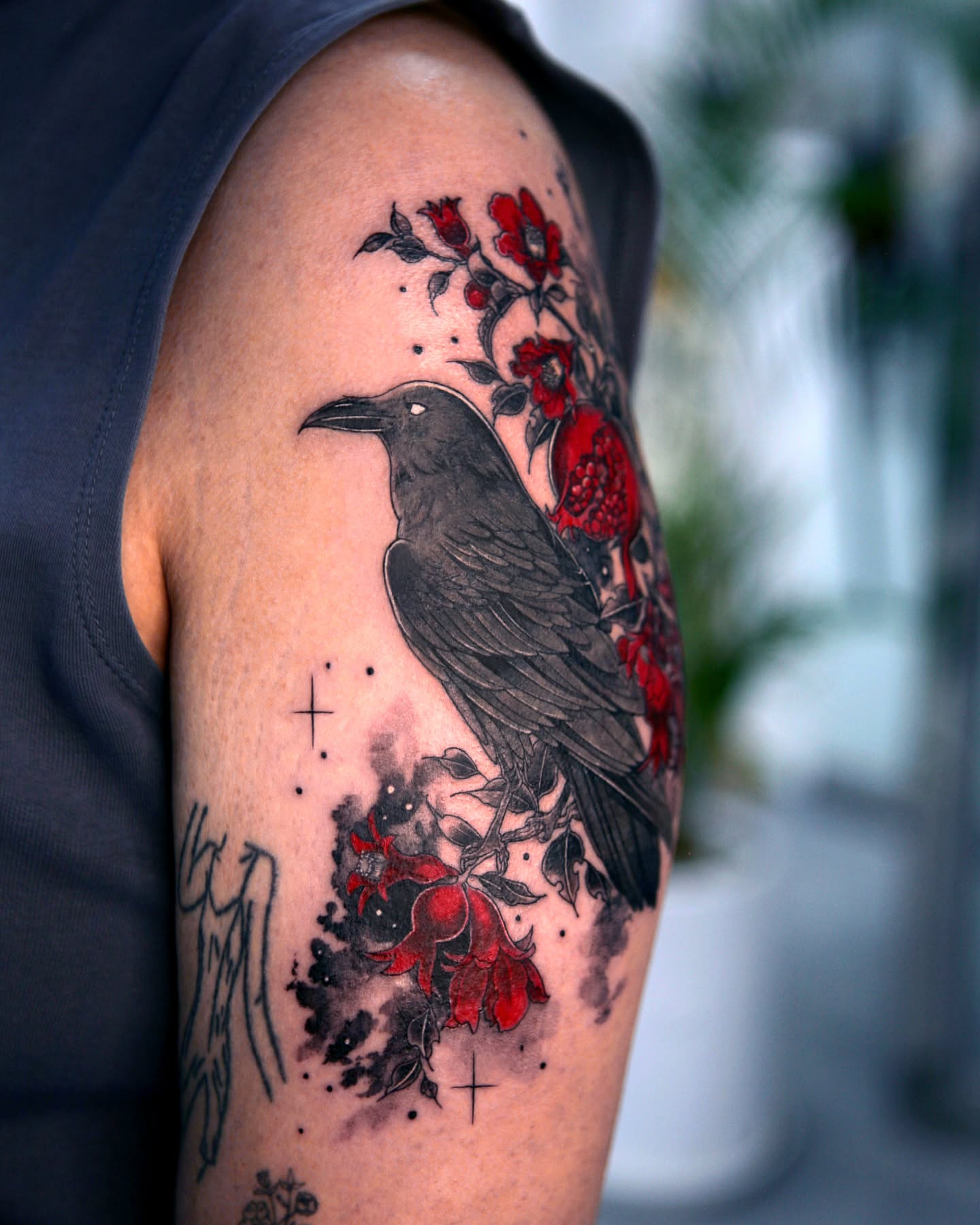 Crow and flowers dotwork tattoo on the upper arm by danha_seoul tattooist