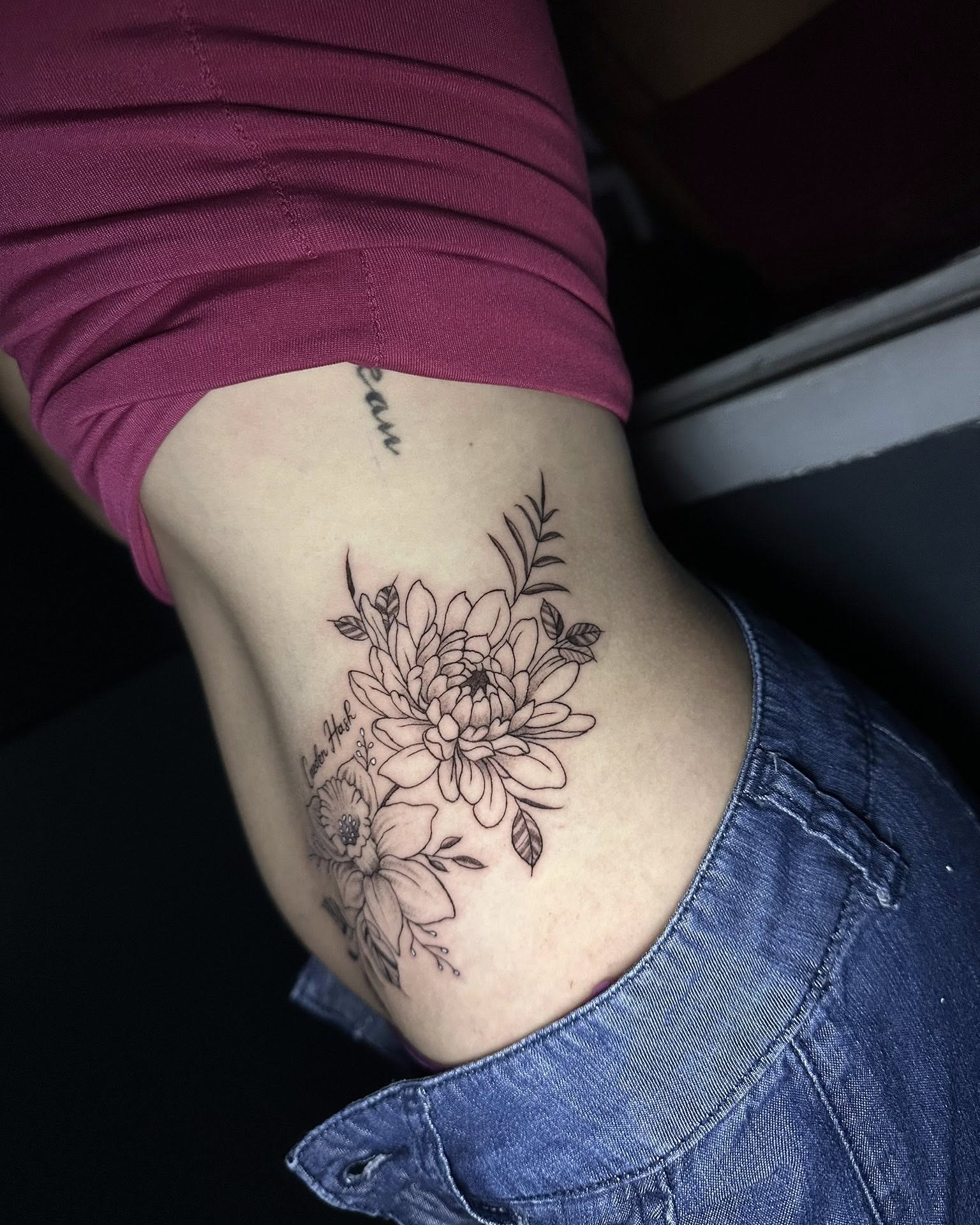 Floral bouquet black and grey tattoo on the ribs by Stephen Degracia