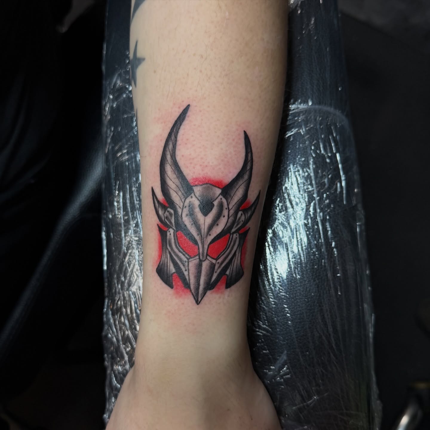 Demon helmet geometric tattoo on the forearm by kobeigh