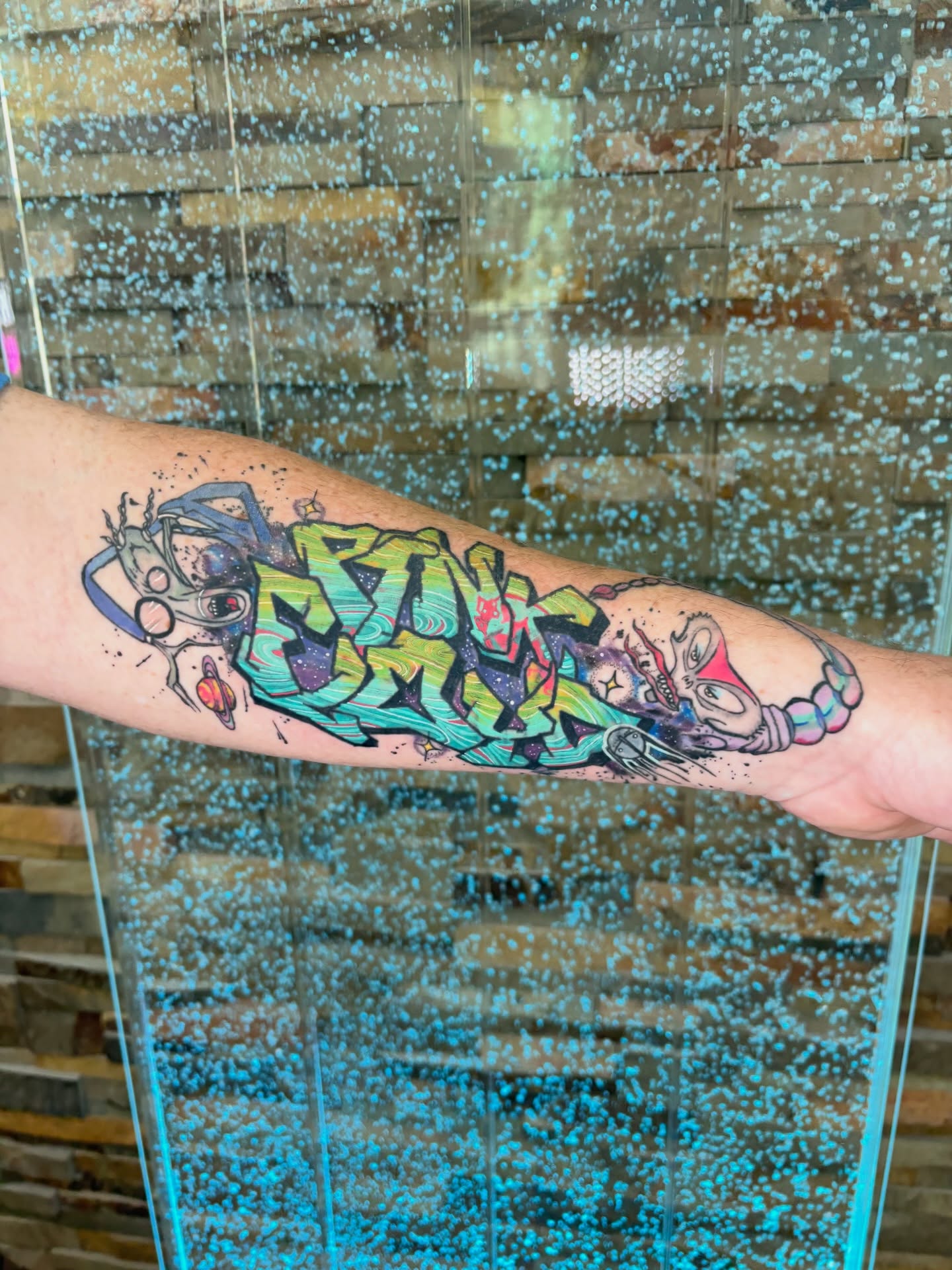 Graffiti-style artwork new school tattoo on the forearm by Stephanie Rowe