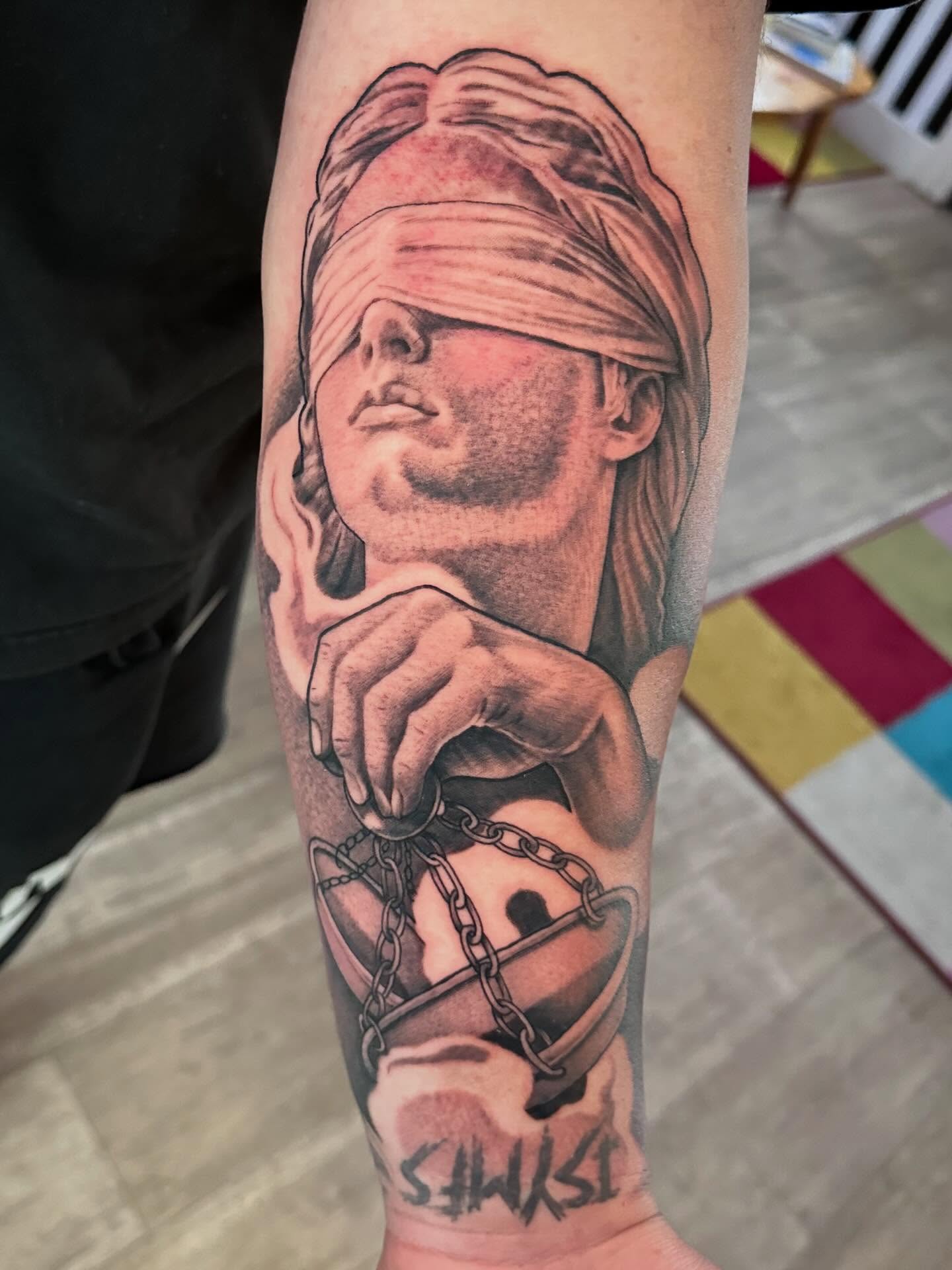 Blindfolded man realism tattoo on the forearm by Dustin Clark, Dayton, Ohio