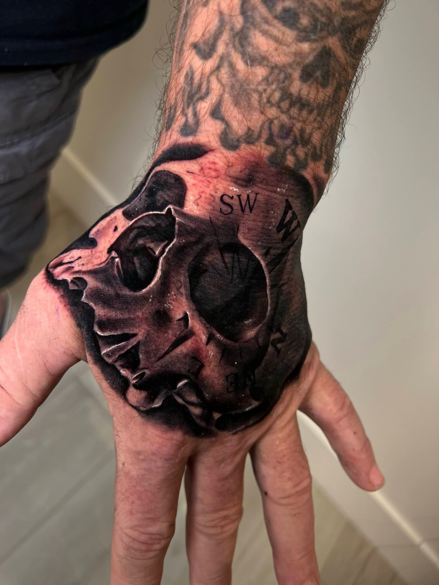 Skull realism tattoo on the hand by Yudel