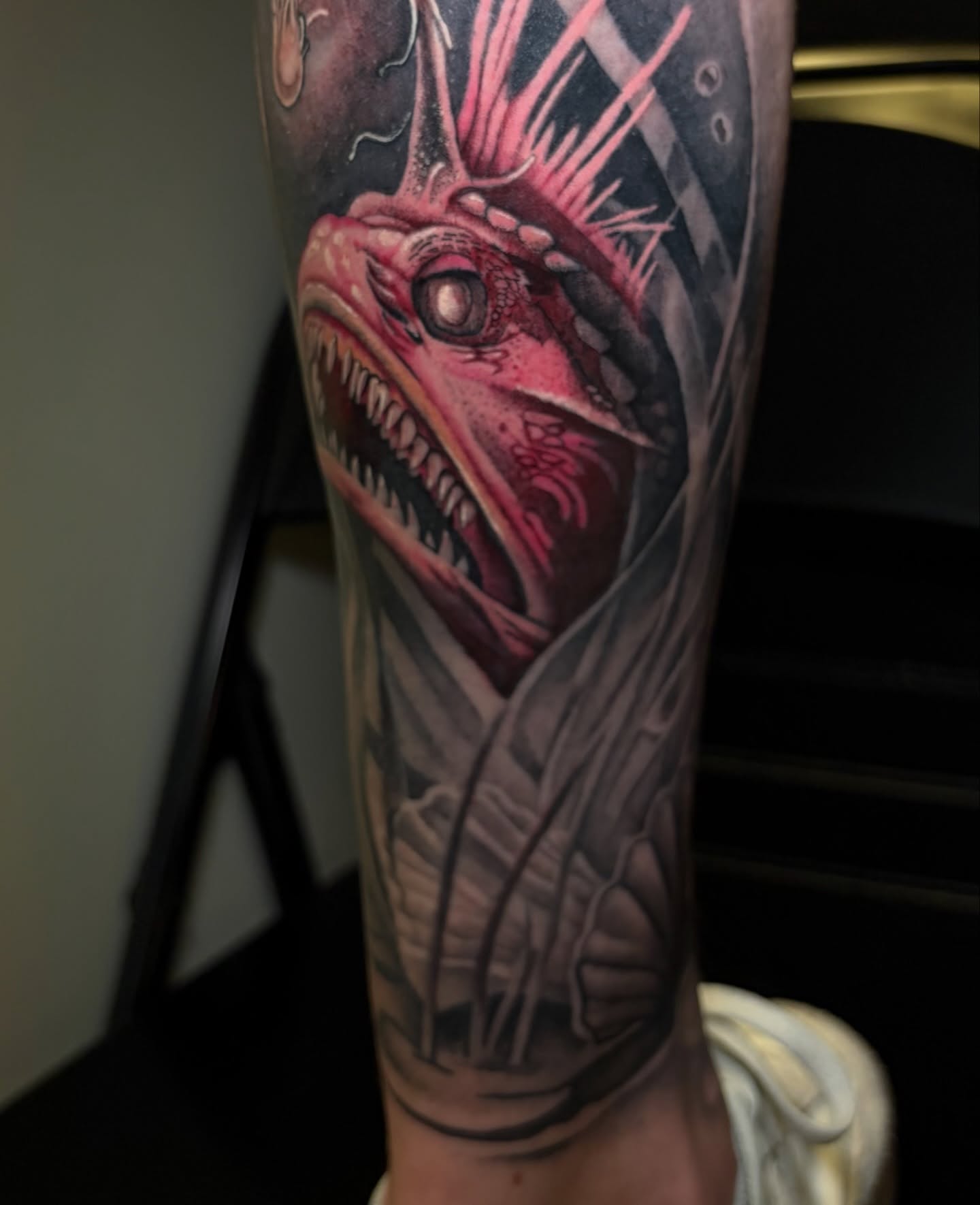 Dragon realism tattoo on the forearm by Zachary Hayden