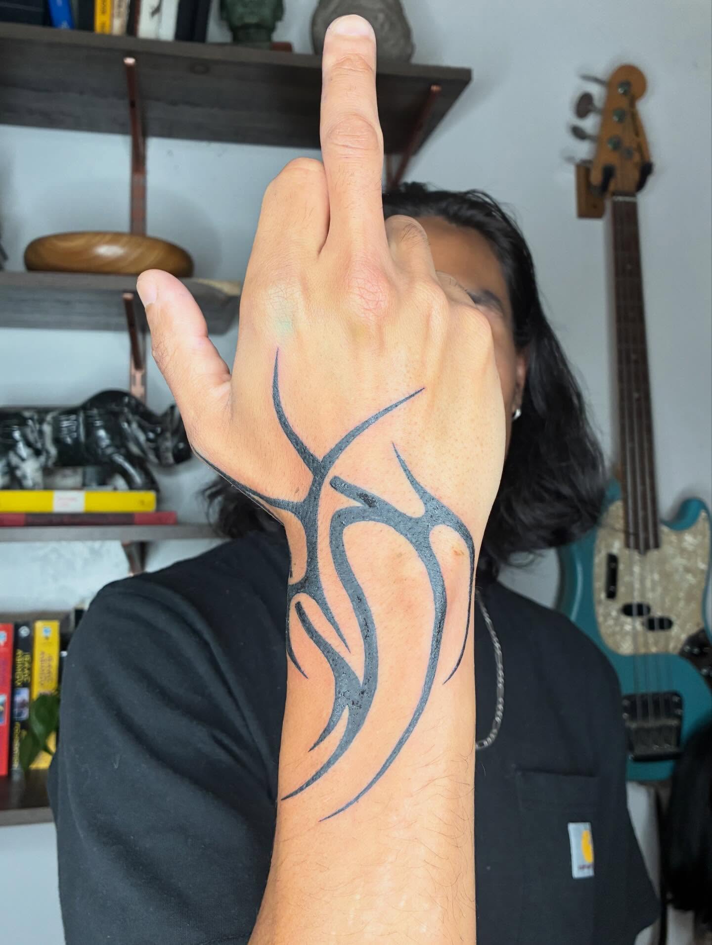 Tribal flame tribal tattoo on the forearm by Steven Sessler, San Francisco, California