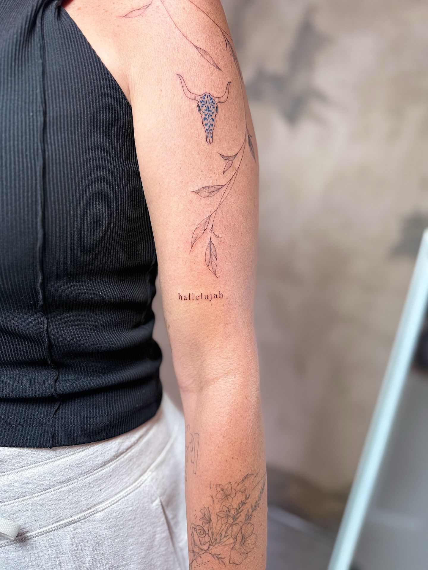 Bull skull and leaf black and grey tattoo on the forearm by INK with Christian, Mineral Wells, Texas