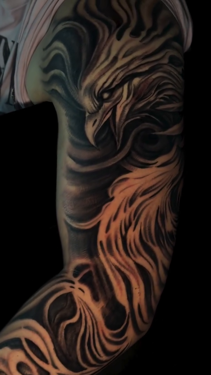 Phoenix realism tattoo by Henry Fuentes