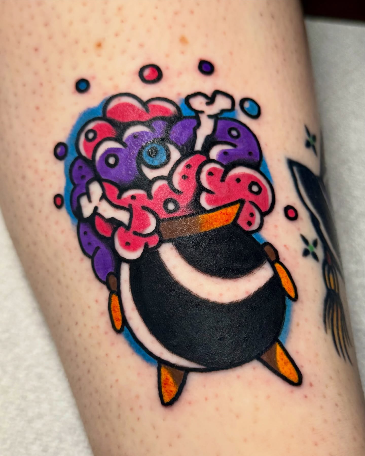 Penguin new school tattoo on the thigh by Javin Klingelhoefer Mosley
