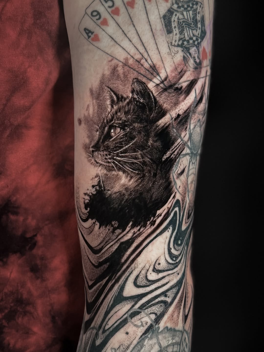 Black cat and playing cards realism tattoo on the forearm by Vince Lau
