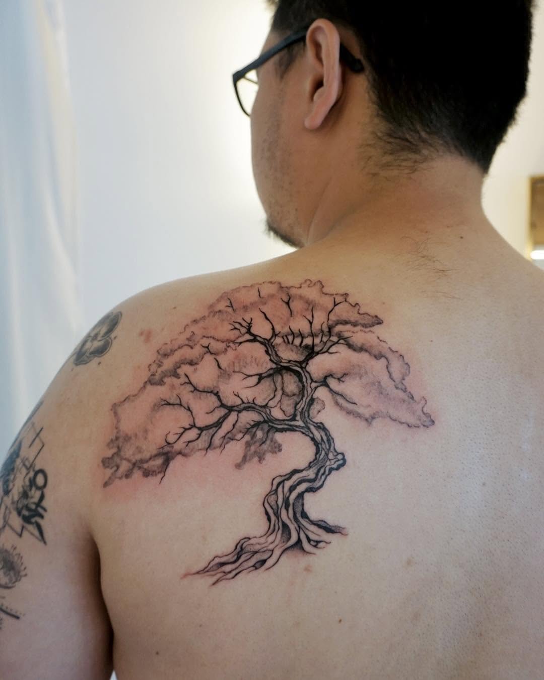 Tattoo by @yuri_tattooer — black_and_grey