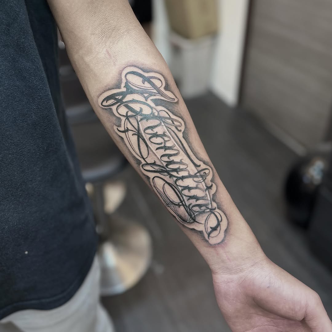 Script lettering lettering script tattoo on the forearm by 墨匠紋身|新店店, New Taipei City