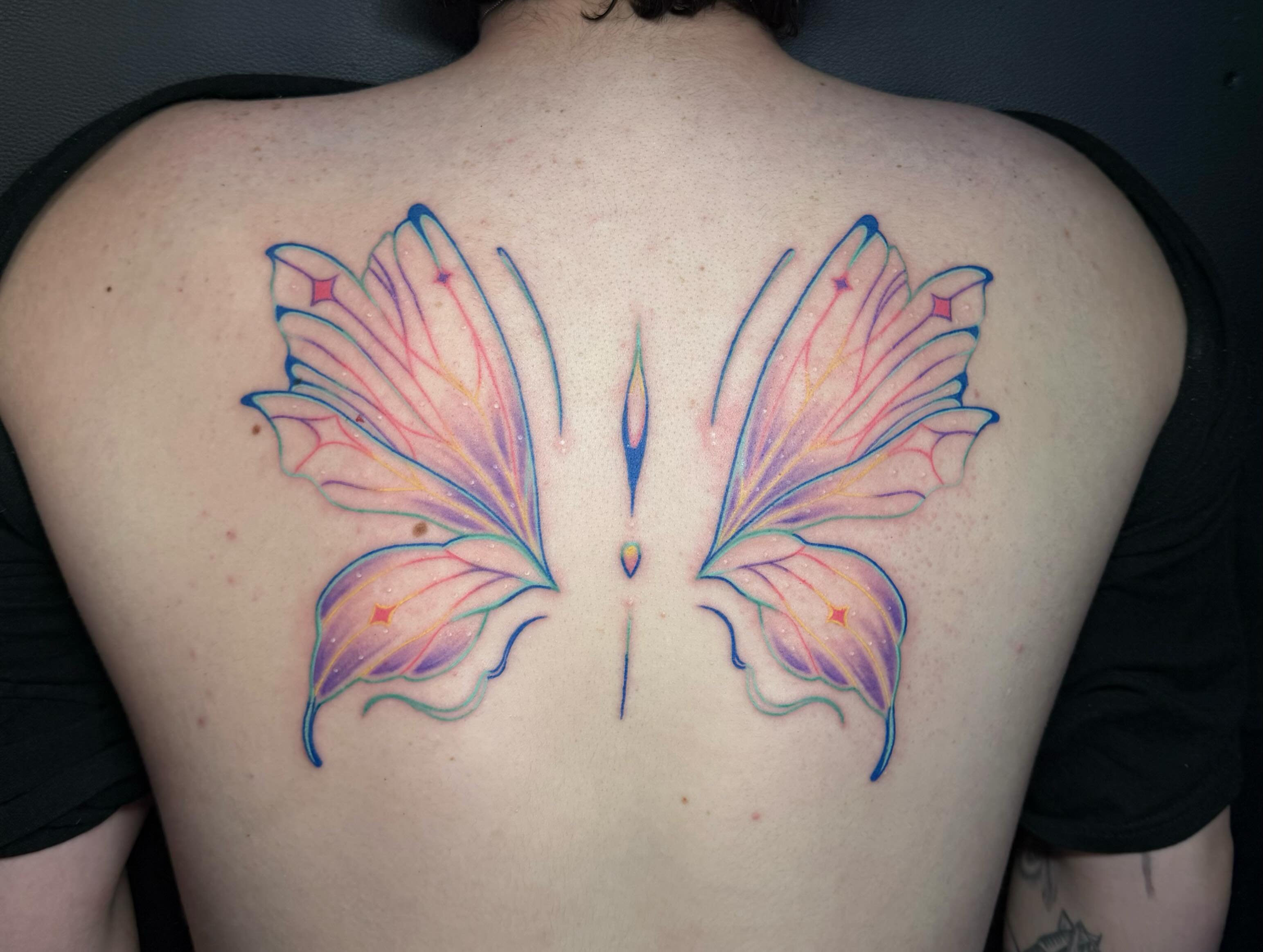 Butterfly wings watercolor tattoo on the back by ✶ teryn ✶, Akron, Ohio