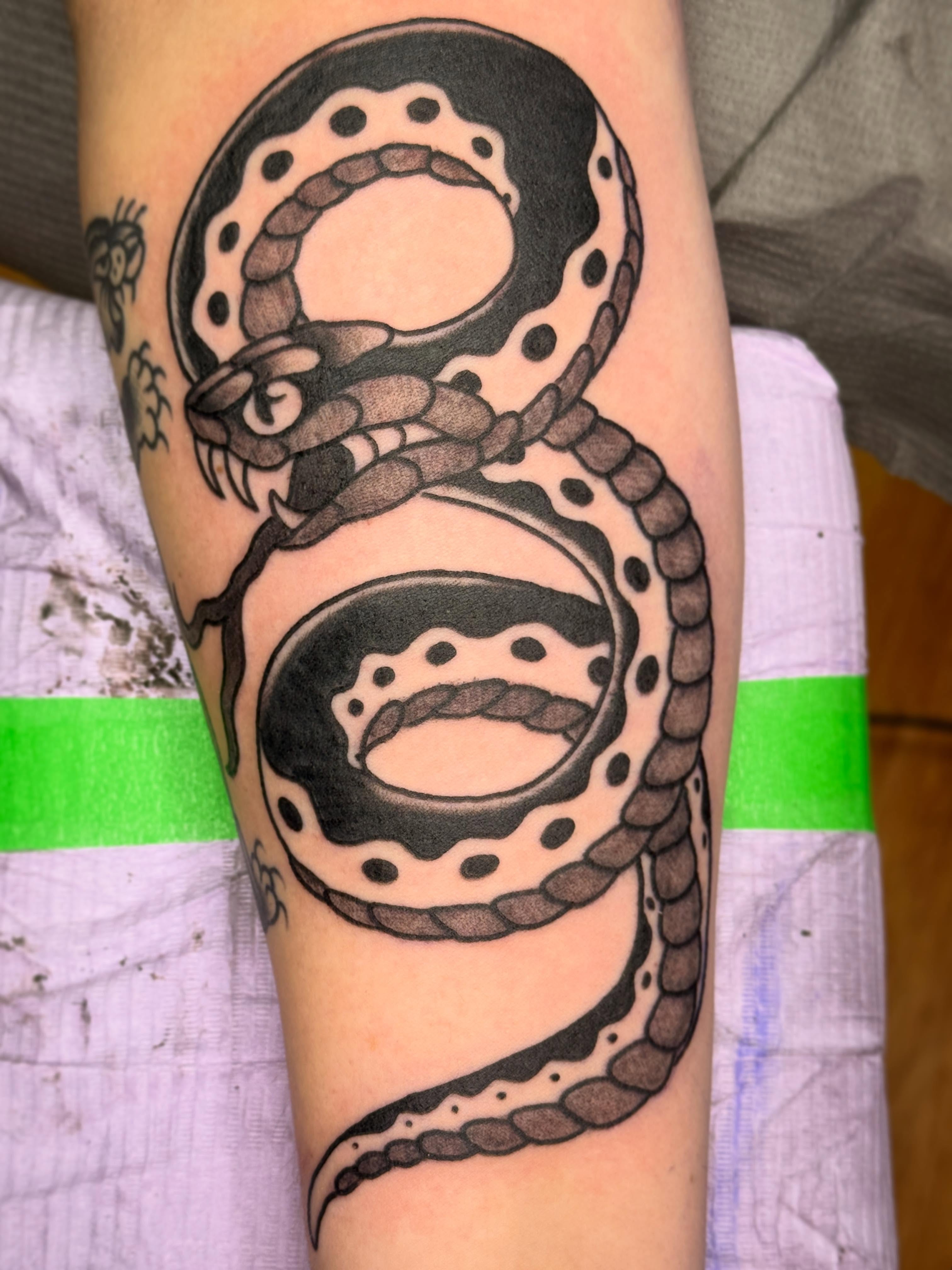 Snake black and grey tattoo on the forearm by 🕸curtis Fink🕸
