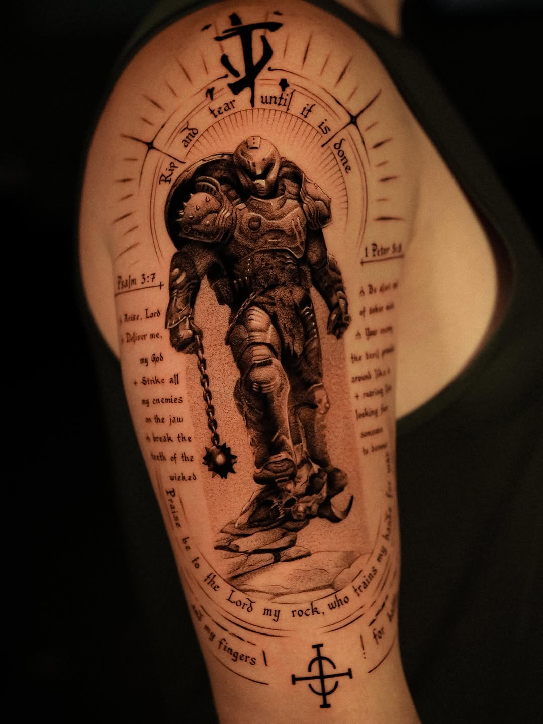 Doom Slayer with religious text tattoo on the forearm by Nikita Grinenko, San Francisco