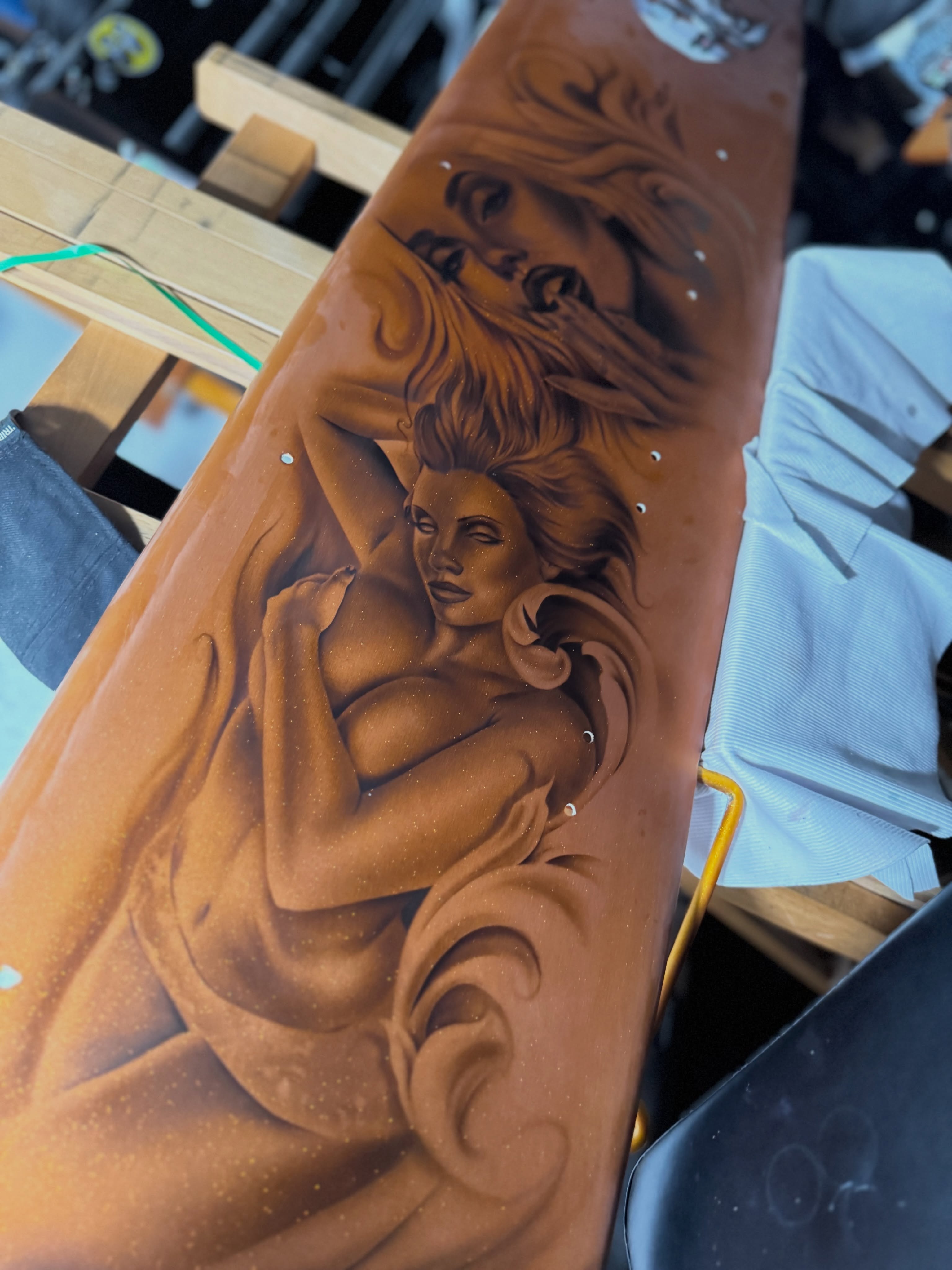 Naked woman realism tattoo on the upper arm by tombstone