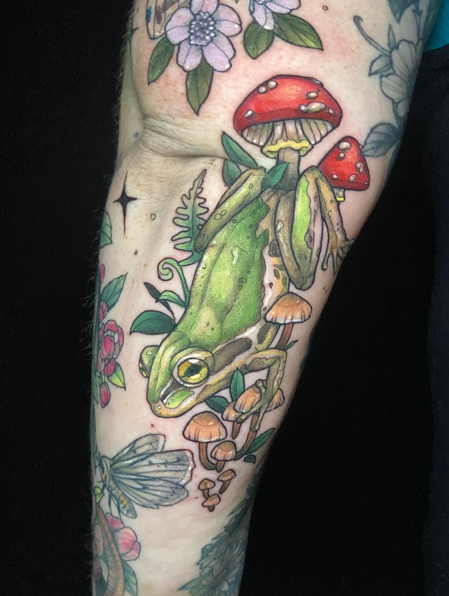 Frog and mushrooms new school tattoo on the forearm by Dawn Carr, Richmond, Virginia
