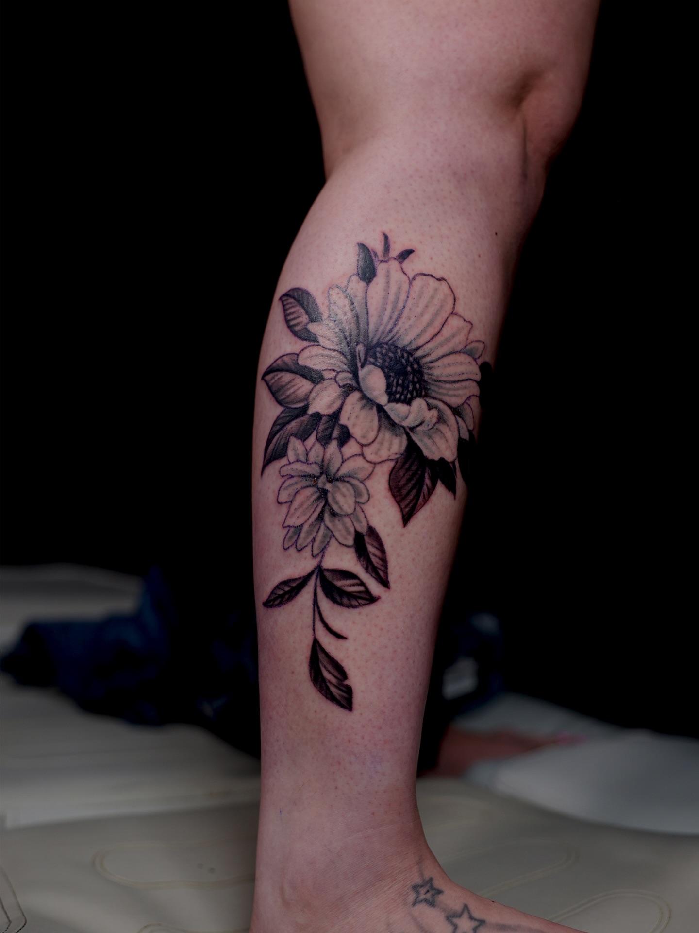 Sunflower and leaves black and grey tattoo on the forearm by InkbyEase, Wayne, New Jersey