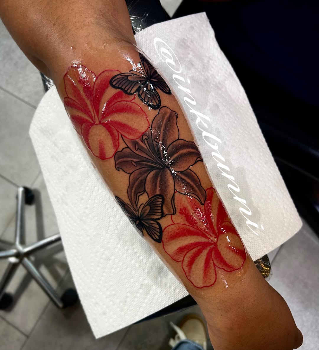 Flowers and butterflies neo-traditional tattoo on the forearm by Hailey Aka inkbunni, Detroit, Michigan