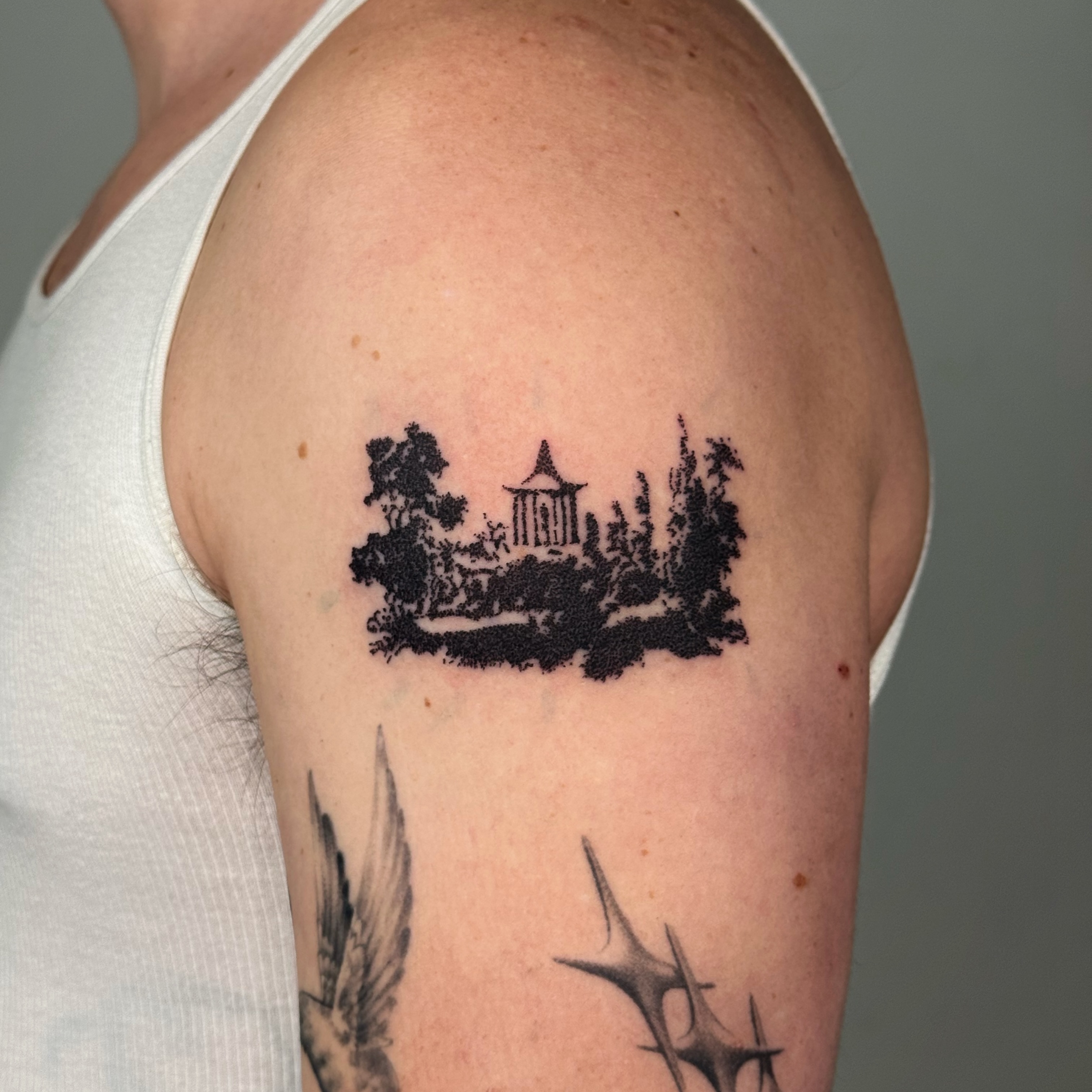 Pagoda and trees black and grey tattoo on the shoulder by Joint Killer