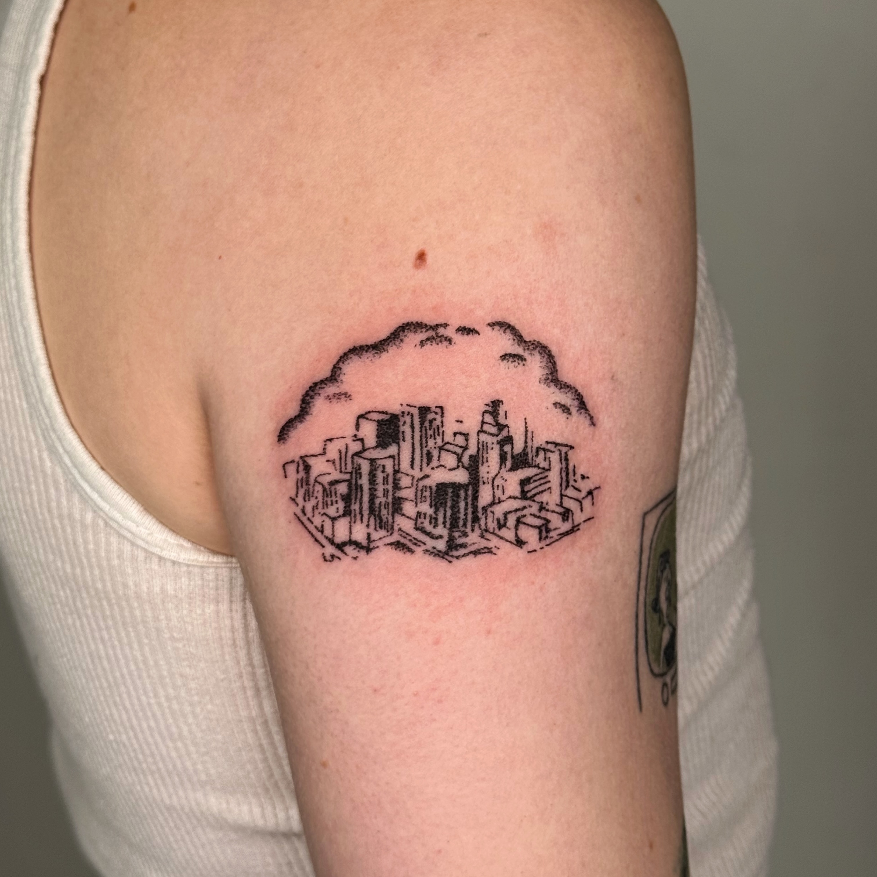 Cityscape black and grey tattoo on the forearm by Joint Killer