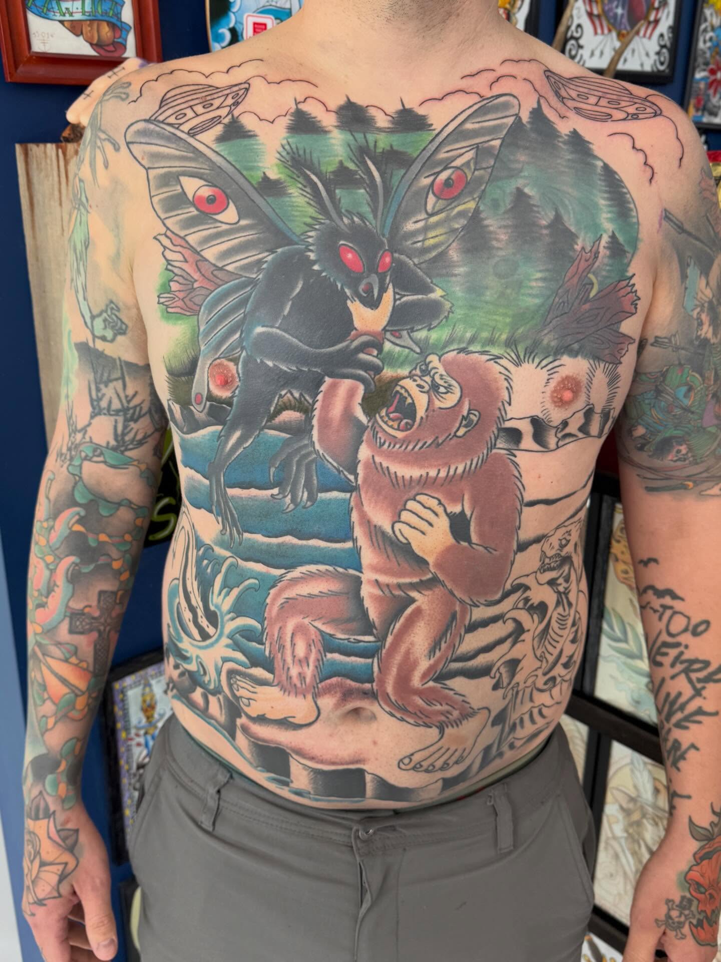 Monster and gorilla American traditional tattoo on the chest by Trent Parsley