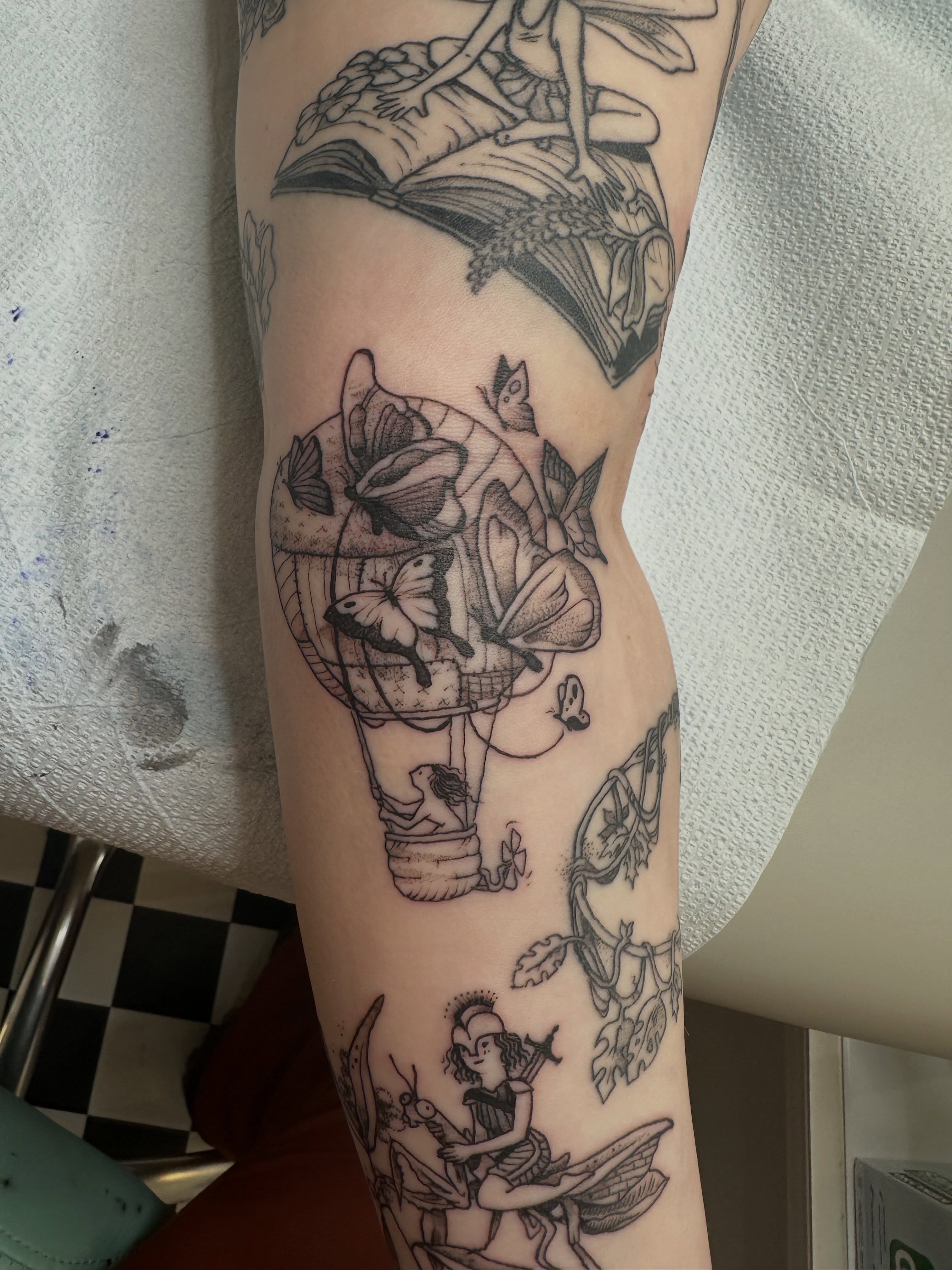 Hot air balloon black and grey tattoo on the forearm by Emma Berger