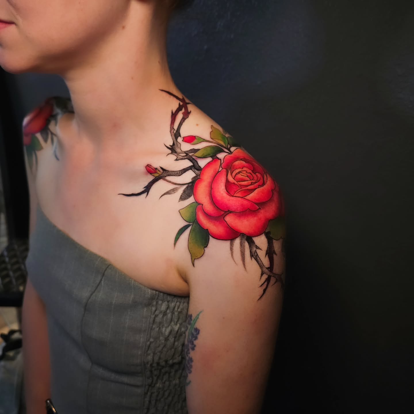 Red rose realism tattoo on the shoulder by Adriannah Esparza