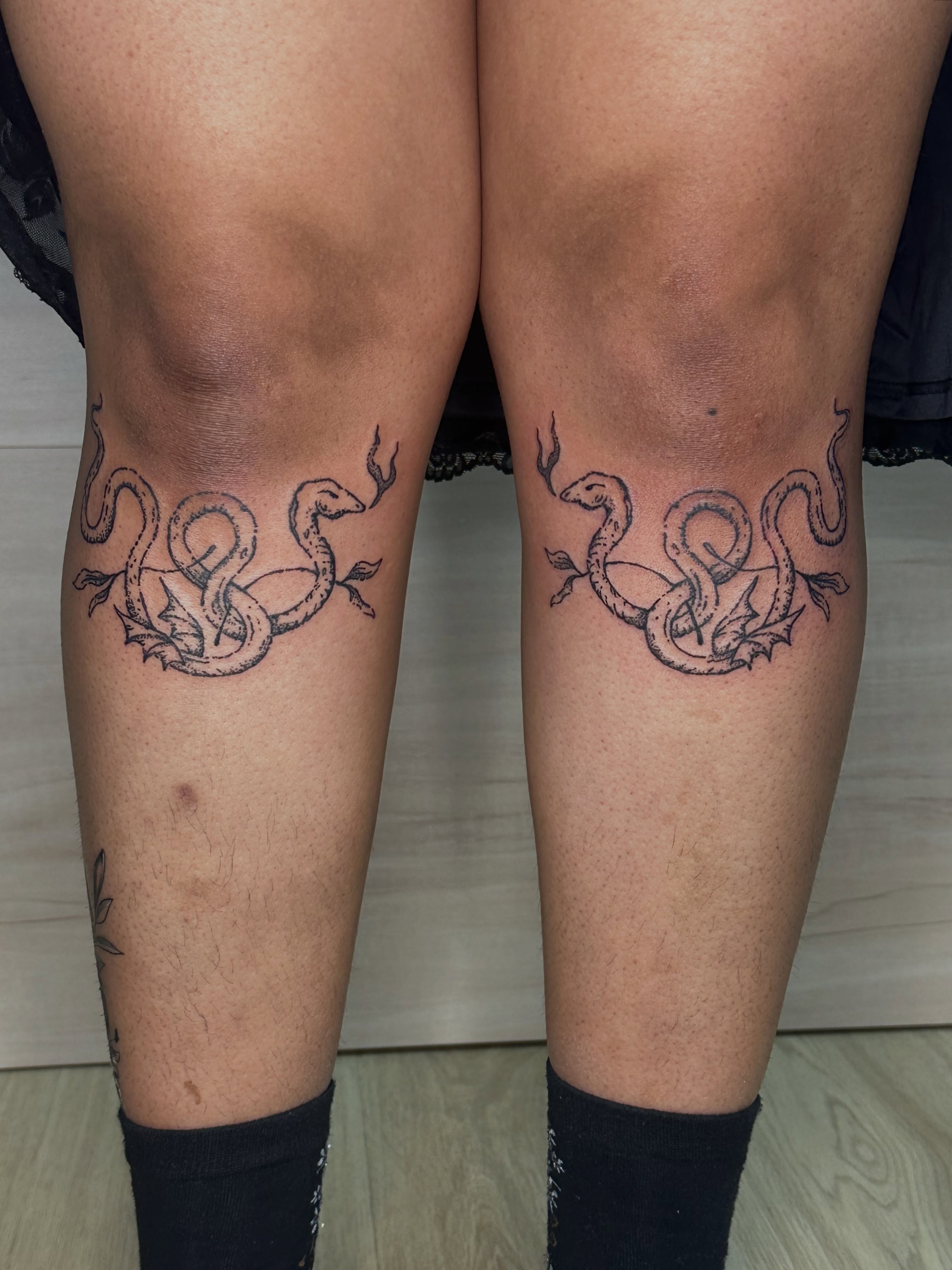 Snakes black and grey tattoo on the thigh by Fleur ๐ฅ
