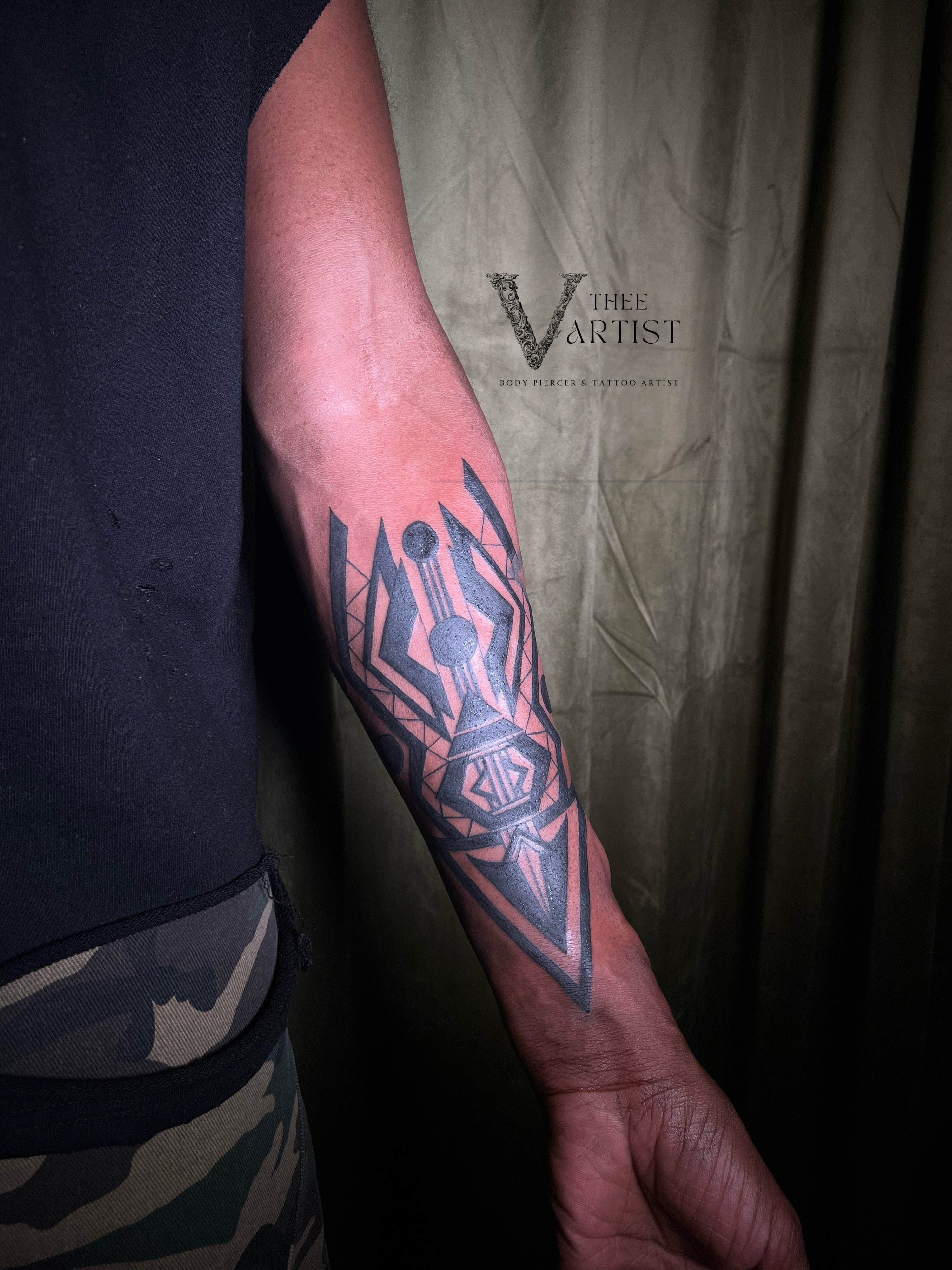Geometric design geometric tattoo on the forearm by V