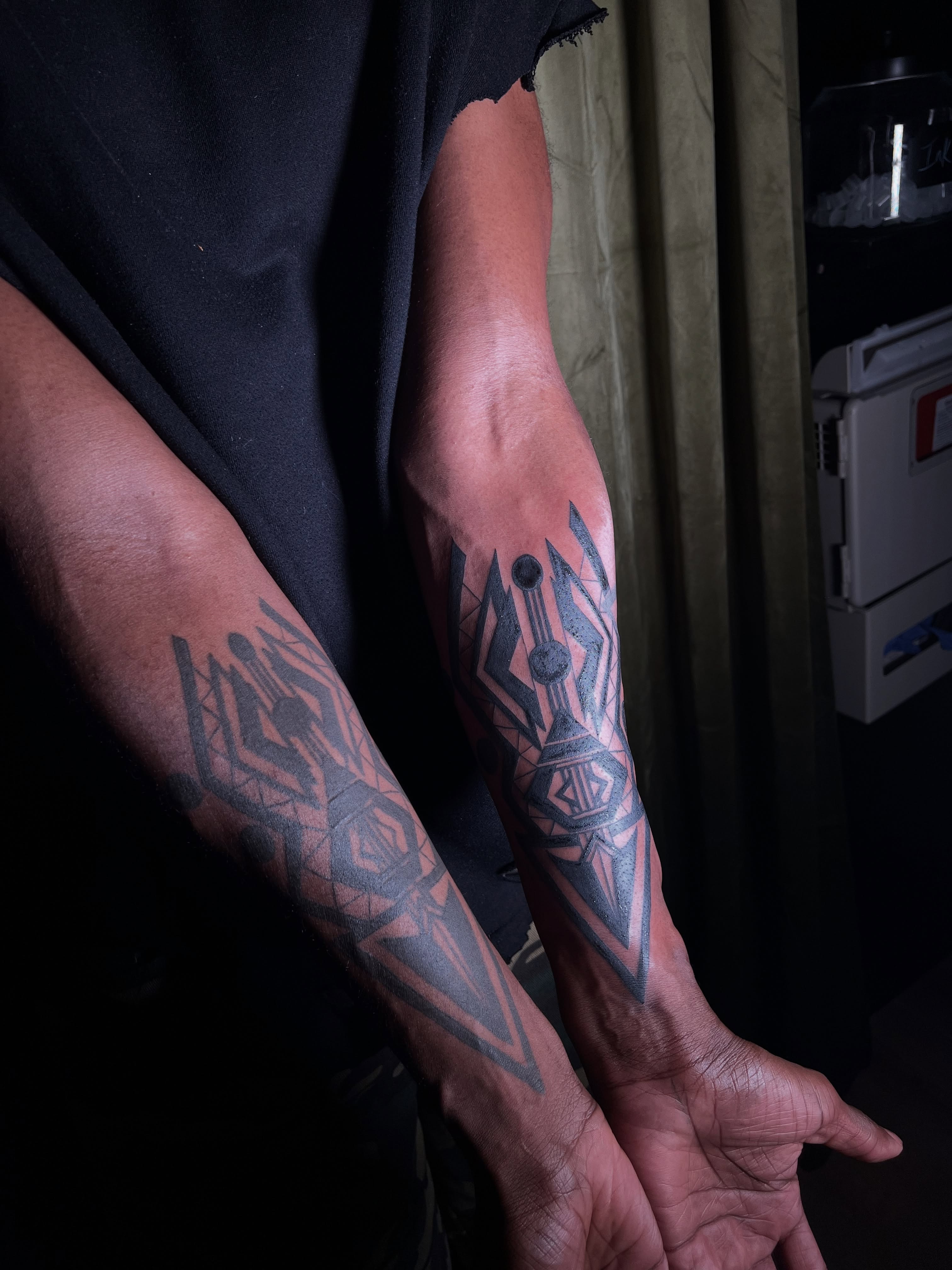 Geometric design geometric tattoo on the forearm by V