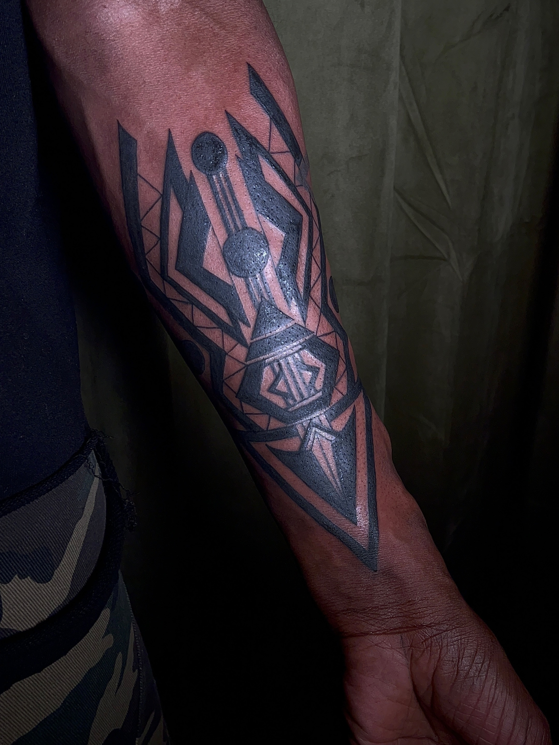Geometric design geometric tattoo on the forearm by V