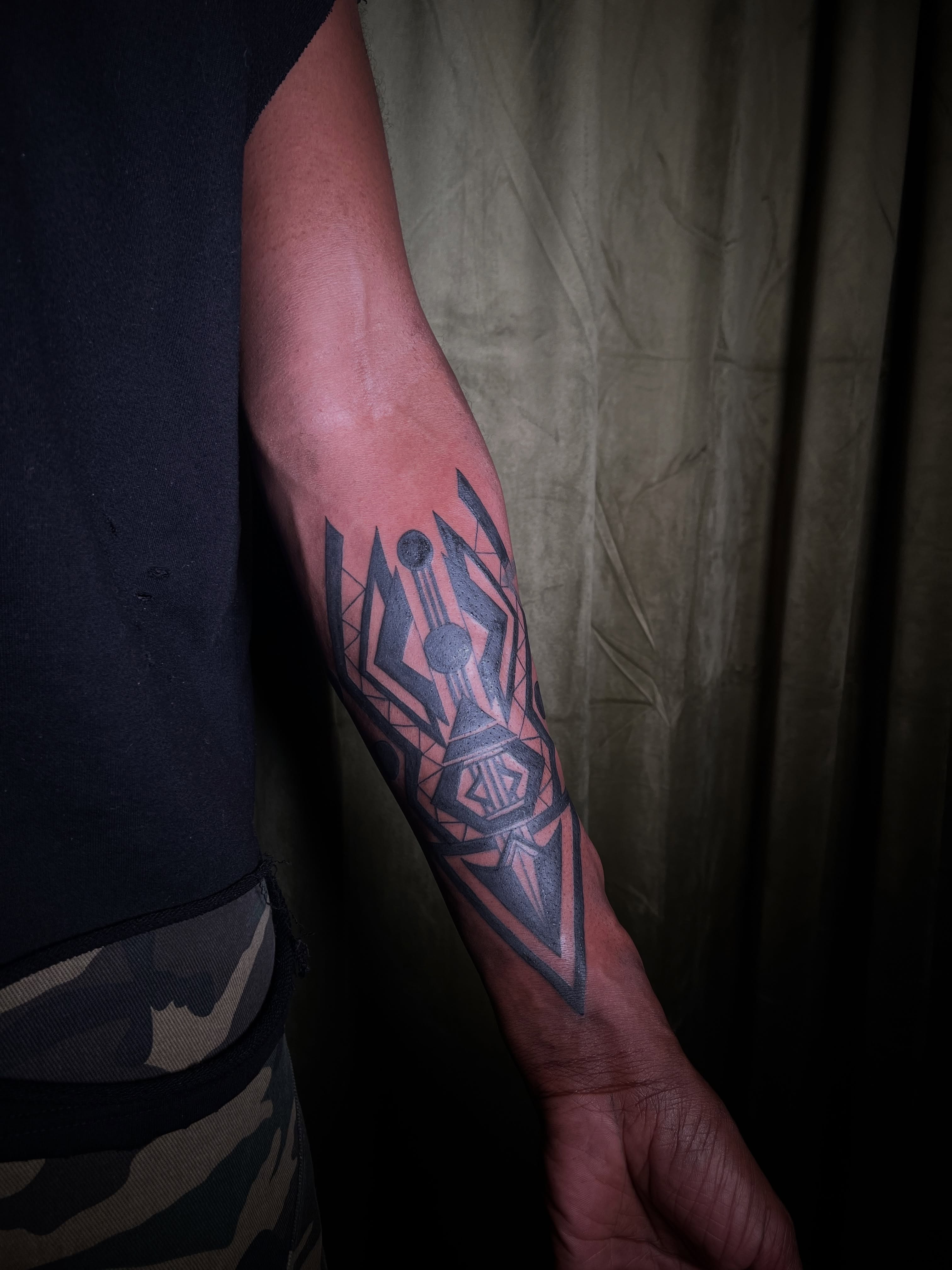Geometric design geometric tattoo on the forearm by V
