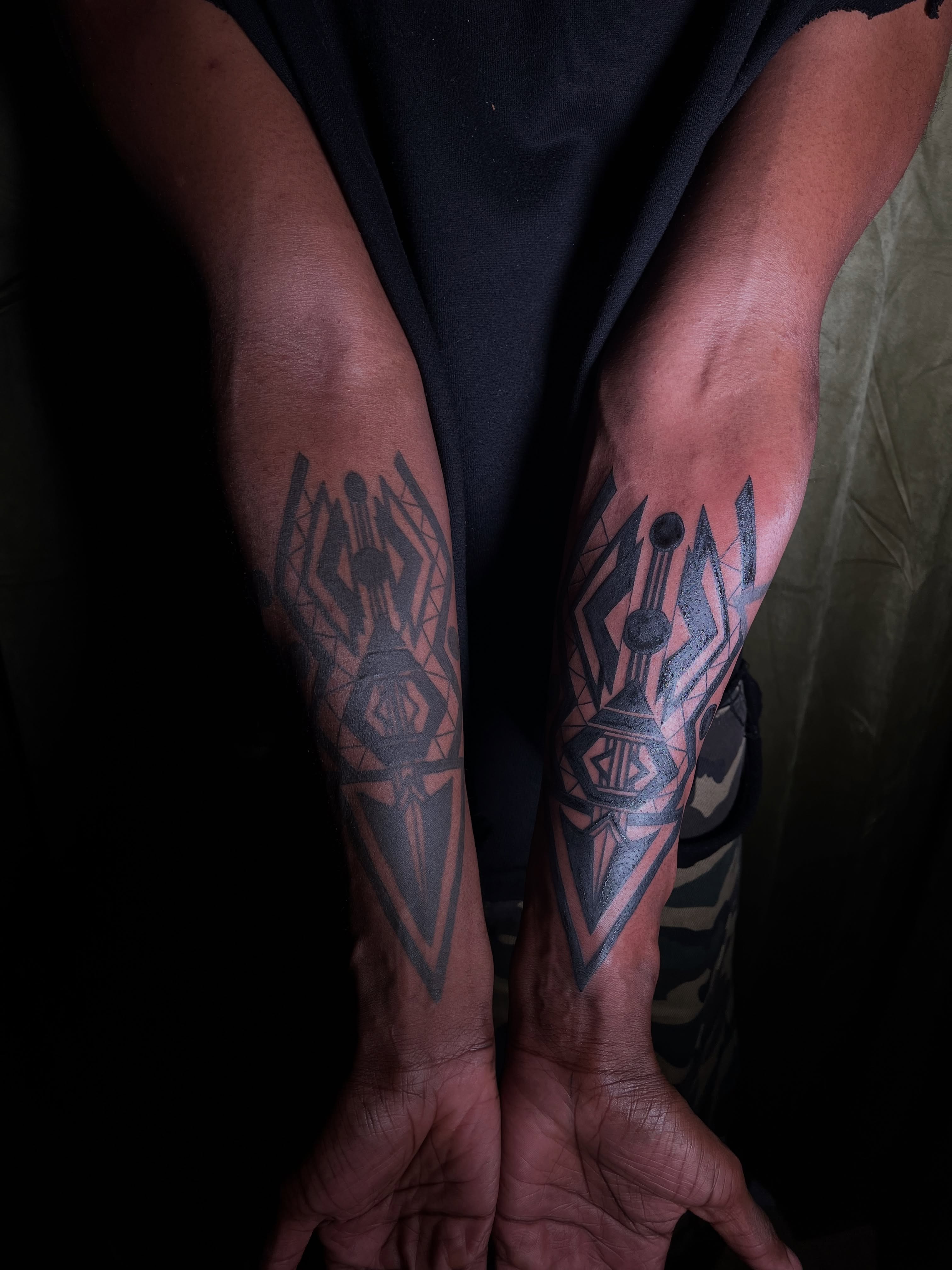 Geometric design geometric tattoo on the forearm by V
