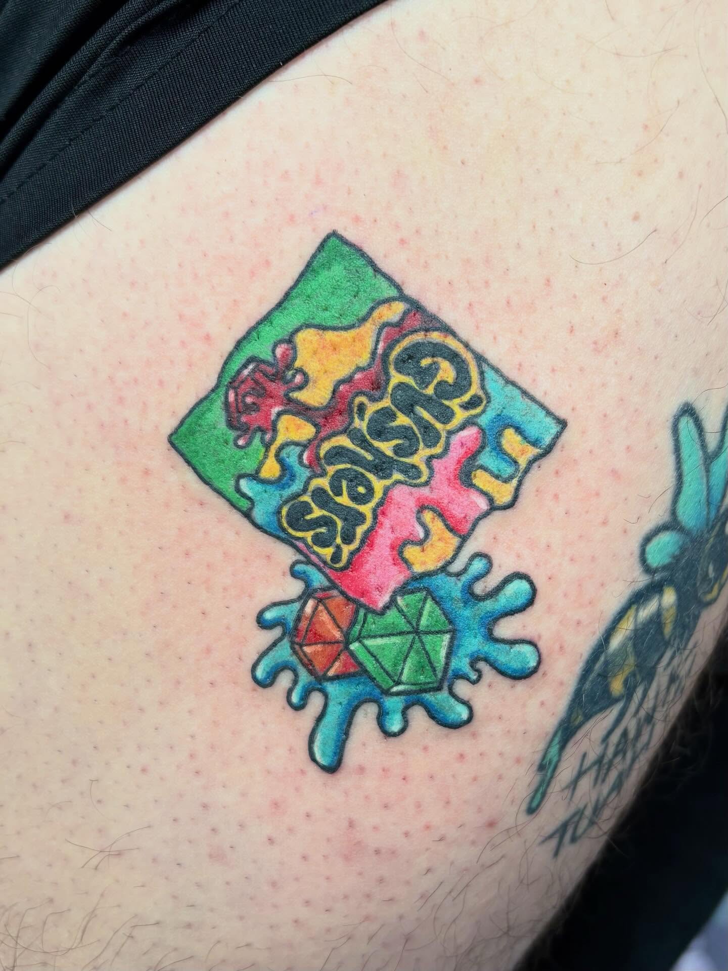 Grisly Fun new school tattoo on the thigh by Bre Alex